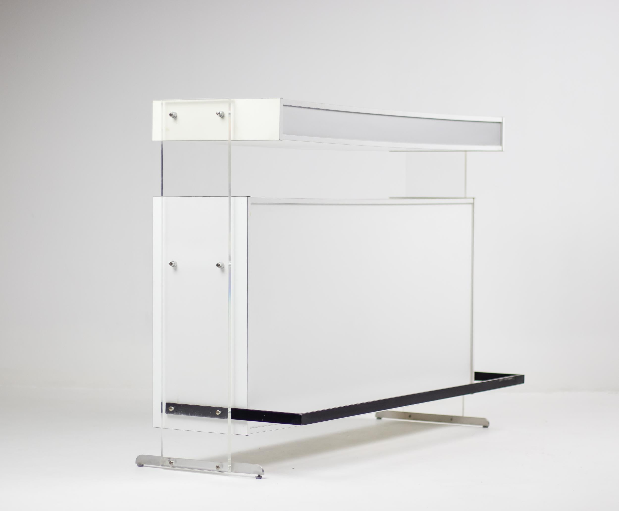Architectural dry bar designed by Poul Nørreklit in 1969 and made by Georg Petersens Møbelfabrik. 
Made in white and silver laminate with acrylic supports on aluminium legs. Great futuristic 