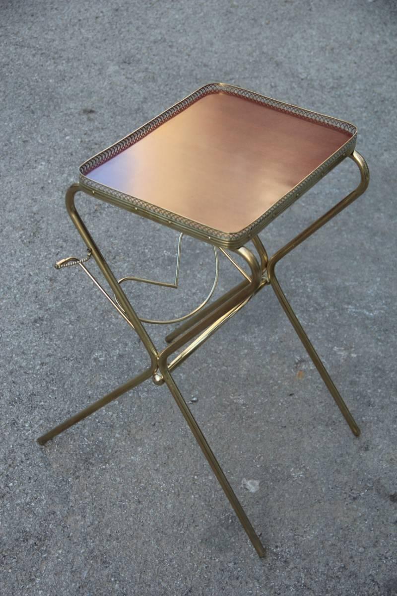 Coffee table dry bar in brass and laminated, magazine rack, particular and original form.