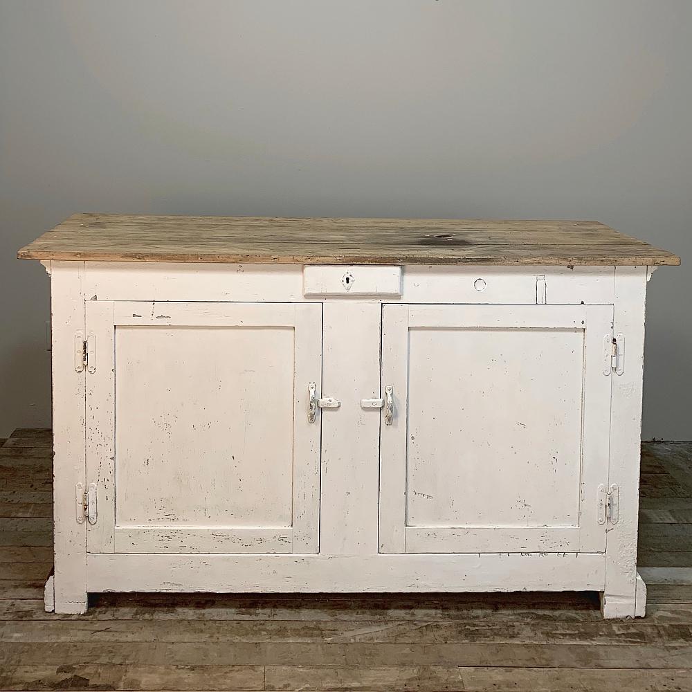 19th century dry bar, counter is a superb example of rustic craftsmanship at its finest, and features three molded panels for visual interest. Ideal in the game room or for entertaining,
circa 1870s
Measures: 39 H x 65.5 W x 23 D.