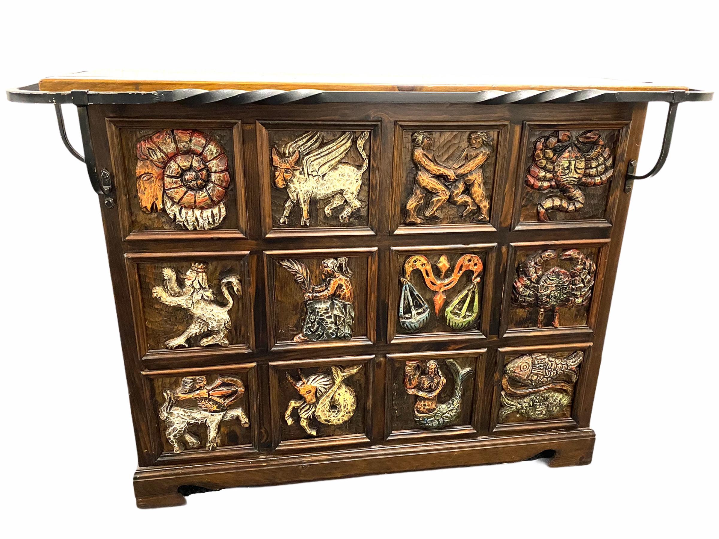 A gorgeous Brutalist dry bar counter, with zodiac signs on the front. Made of wood and metal, Germany, 1970s.
It is in original as found condition with signs of wear as expected with age and use. Obviously this item is not new, so please check all