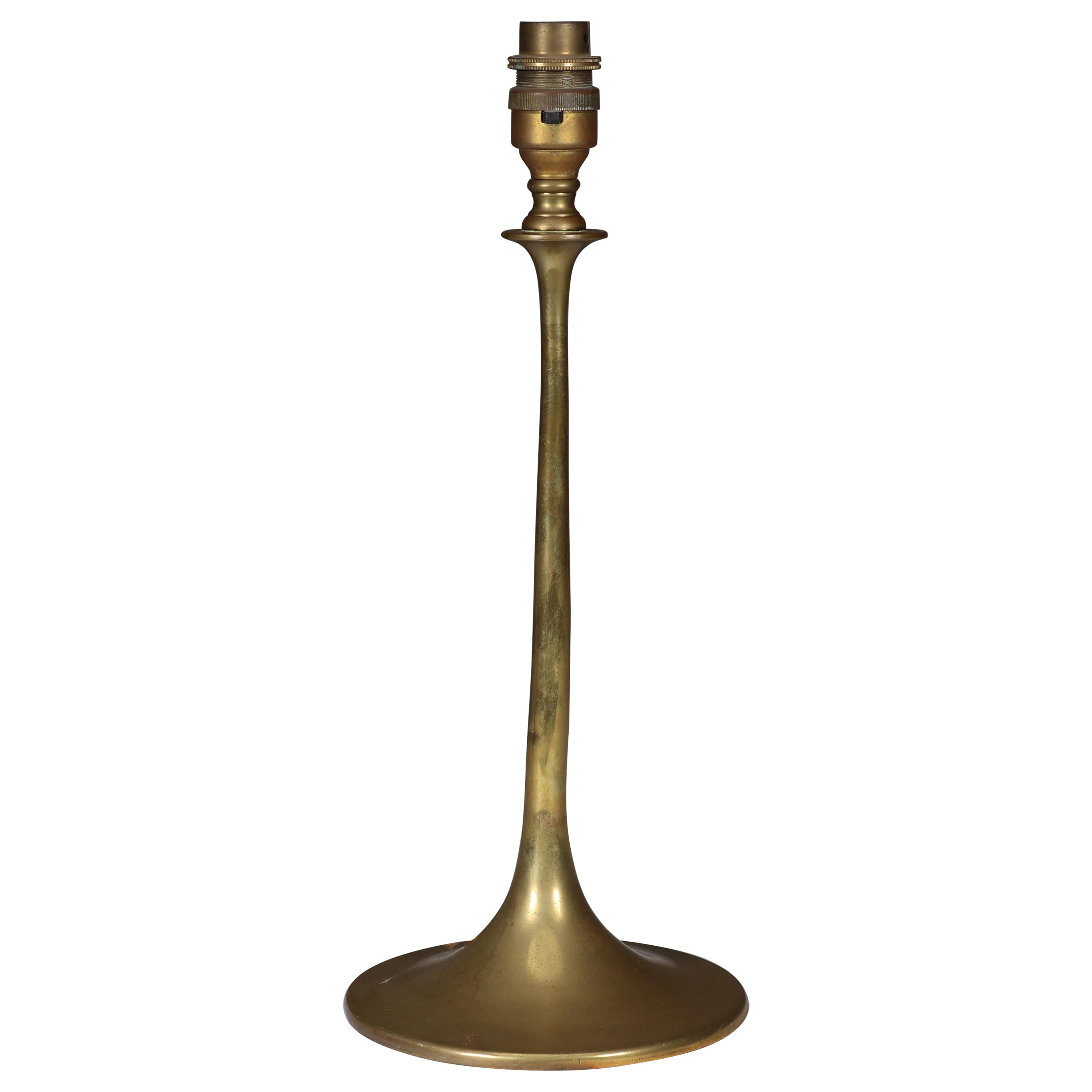 Dryad in the style of An Arts & Crafts brass table lamp with a wide flaring base