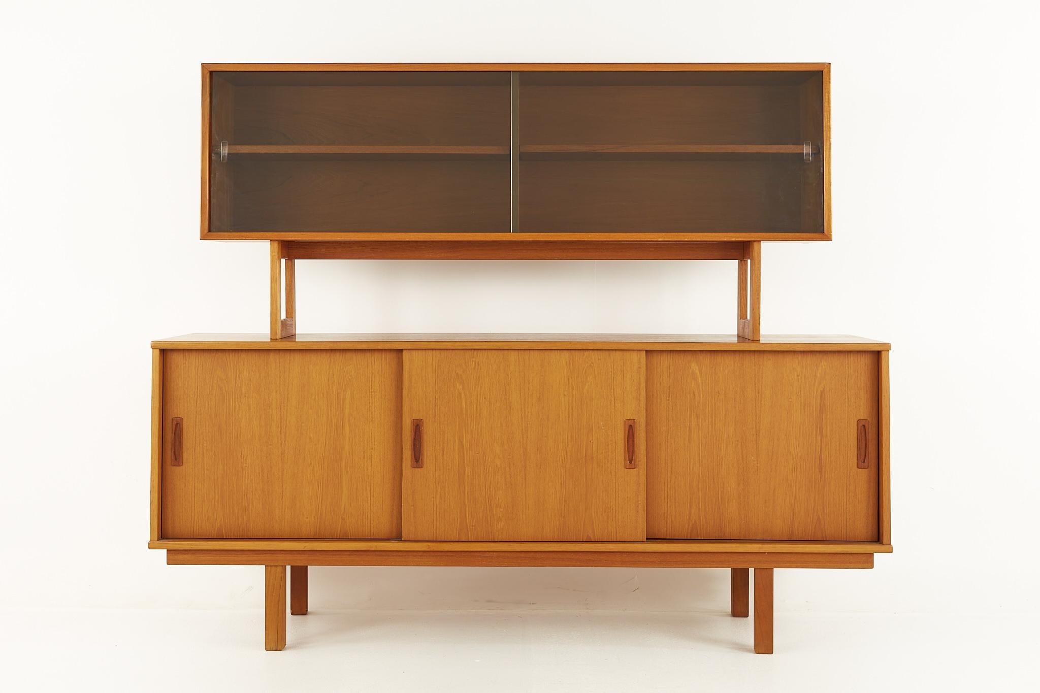 Drylund Danish mid century teak buffet and hutch

This buffet measures: 71.5 wide x 17 deep x 30 inches high

This hutch measures: 63 wide x 11.75 deep x 27.75 inches high, with a combined buffet and hutch height of 57.75 inches 

All pieces