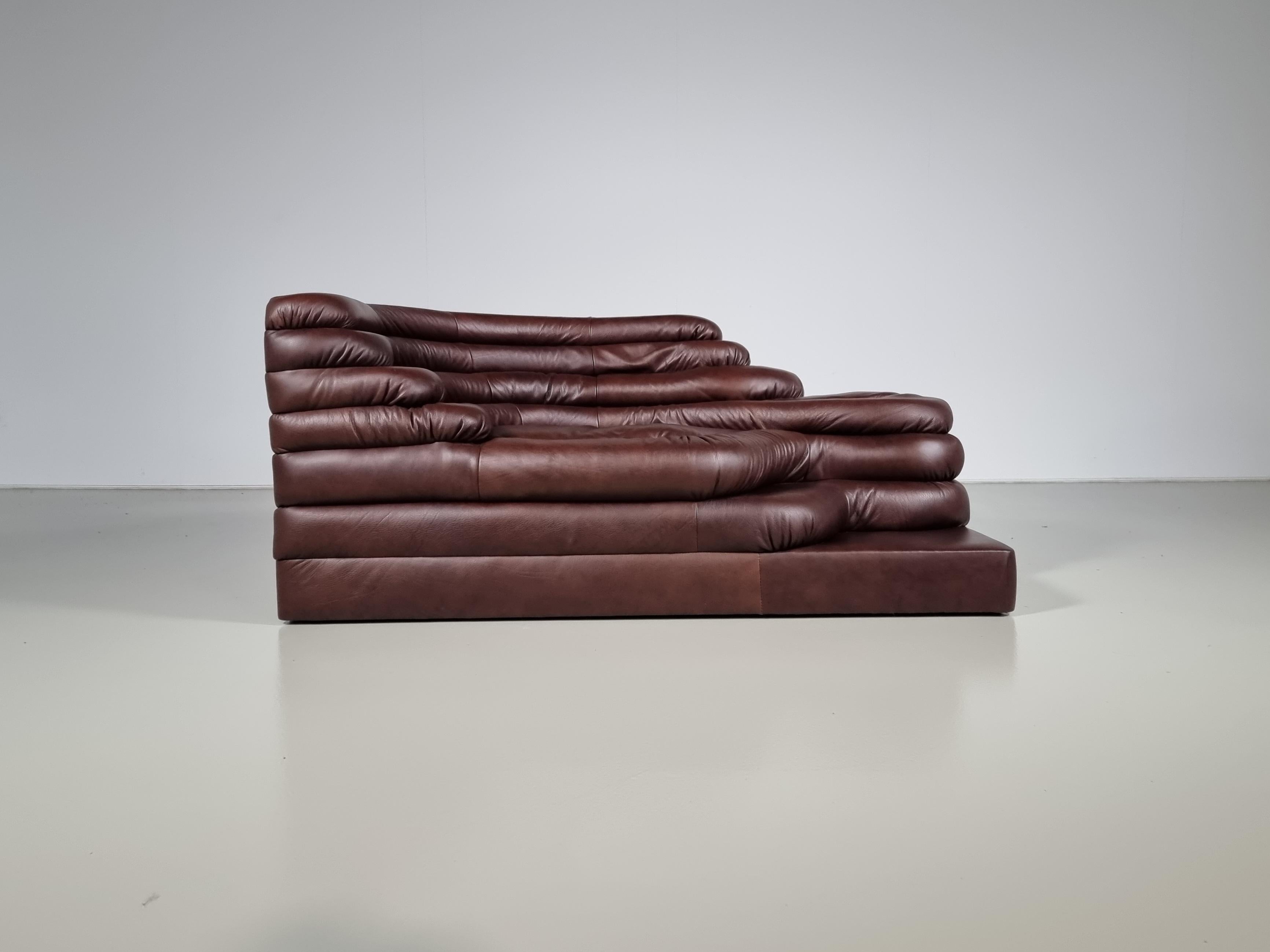 DS-1025 Terrazza Landscape sofa in the original brown leather. Designed by Ubald Klug for De Sede. The design of this sofa was inspired by waves, waterfalls, and rock formations which are clearly visible in the layering of the sofa. Very comfortable