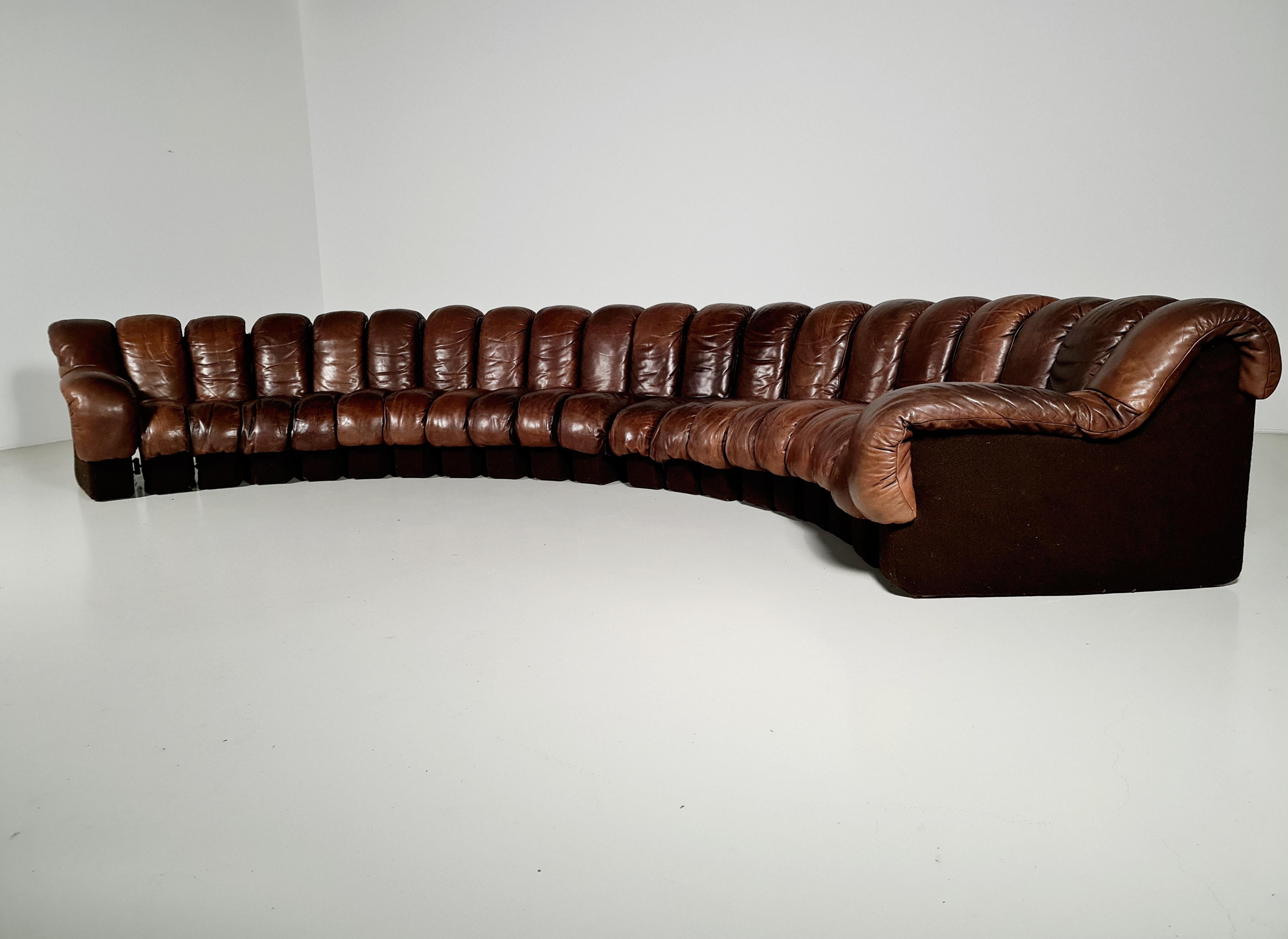 De Sede, DS600, 1970s

This De Sede sofa in stunning patinated brown leather is designed by Ueli Bergere, Elenora Peduzzi-Riva, Heinz Ulrich and Klaus Vogt. This sectional sofa contains 20 seating pieces with two armrests. The pieces can be zipped