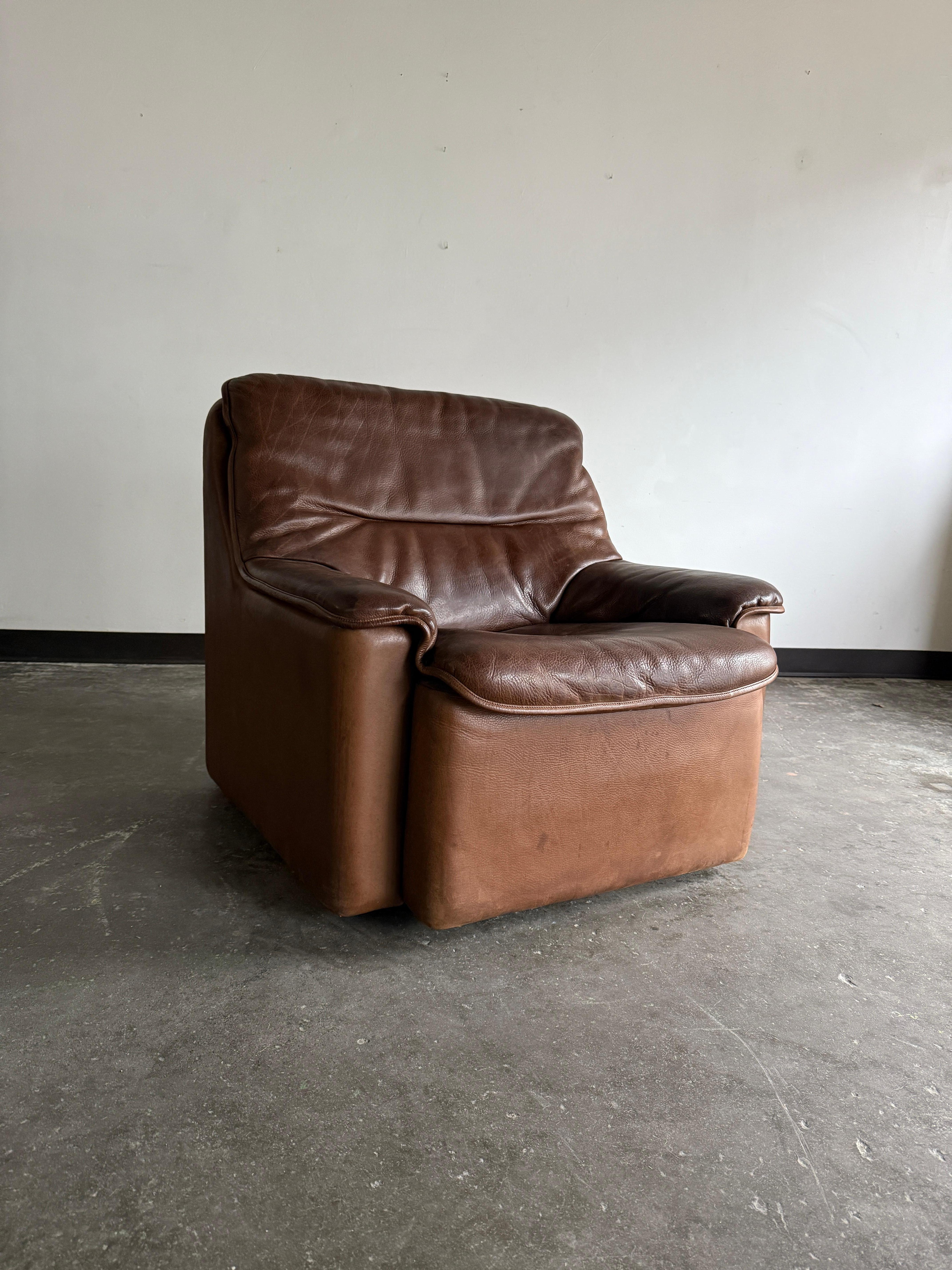 Extremely durable, comfortable, and supple buffalo leather chair with the most perfect patina. Chair is fairly heavy due to its solid wood frame. Has been thoroughly cleaned and conditioned and is ready for use.