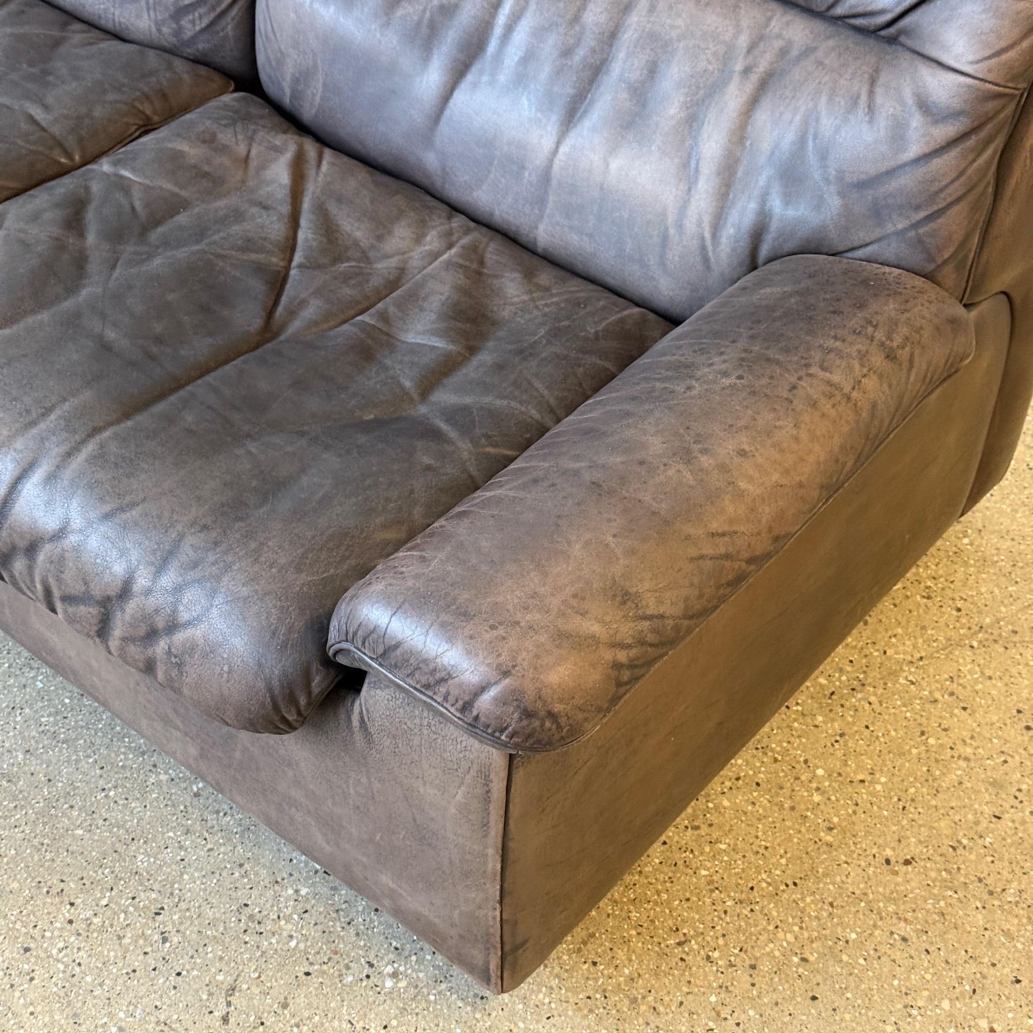 c. 1970s. Switzerland. Full buffalo leather construction, matching chairs available. 

