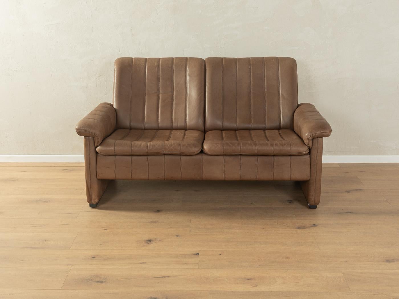 Classic DS-83 sofa from the 1970s by de Sede with the striking original cover made of brown leather with beautiful patina and coarse stitching.

Quality Features:

    very good workmanship
    high-quality materials
    Made in Switzerland,
