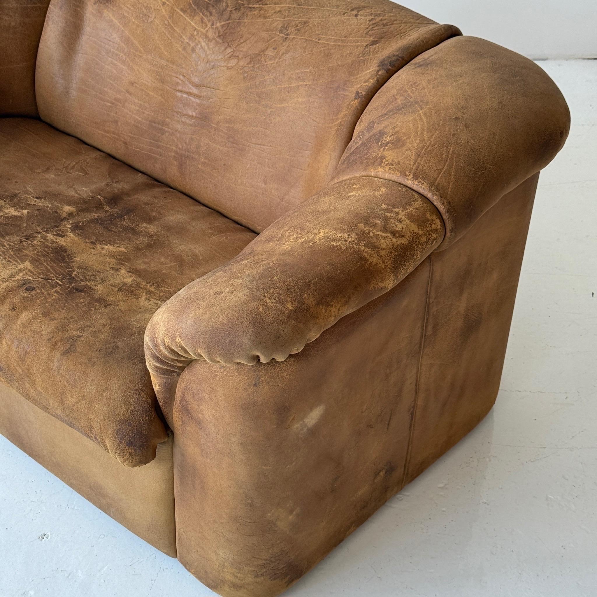 c. 1970s. Switzerland. Full buffalo leather construction. 

