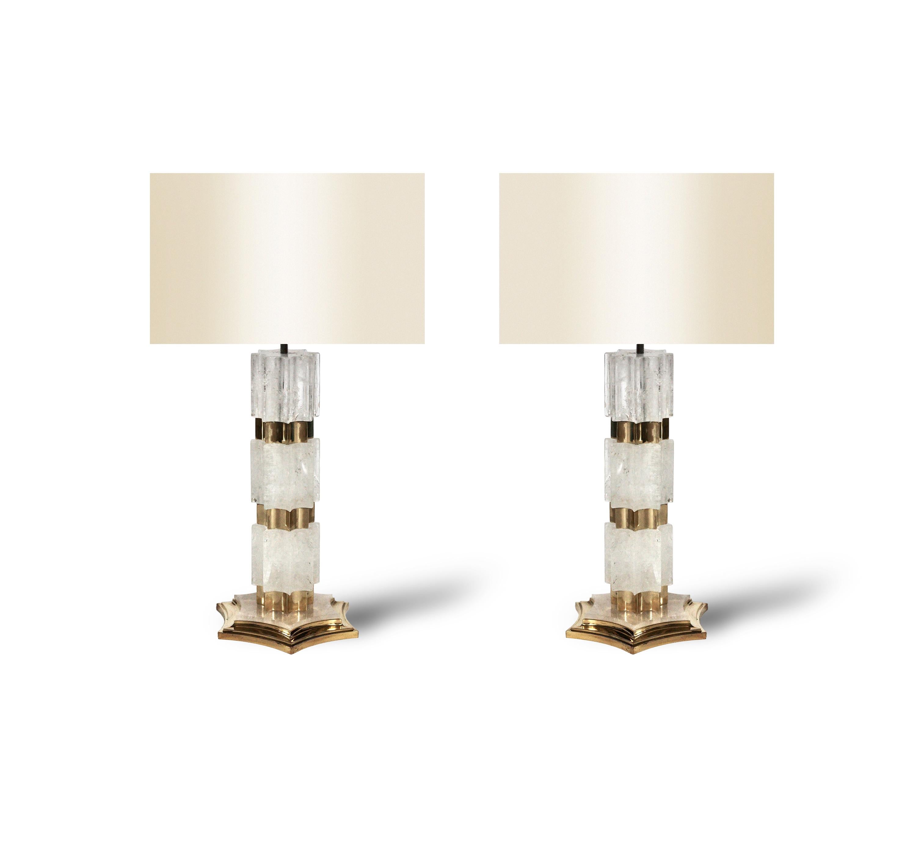 Pair of finely carved rock crystal lamps with polish brass decoration.

To the top of rock crystal 13 inch.

Created by Phoenix 

Lampshades are not included.

