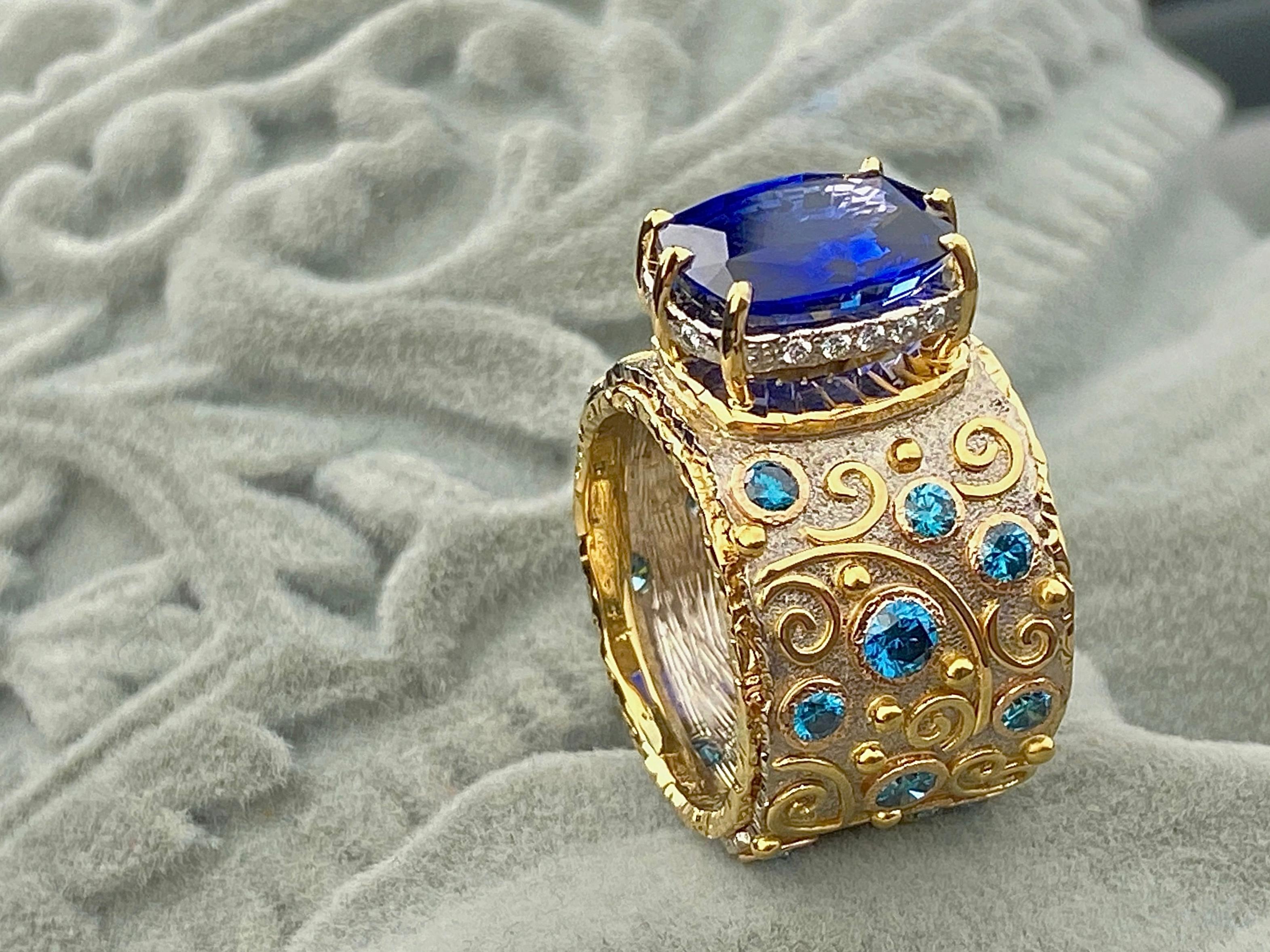 This is magnificent sapphire 6,15 ct worn on the hand engraved band made of white 18kt gold and with yellow laid inlays decorated with 19 blue diamonds and 14 white diamonds VVS/G. Total diamonds 1,18ct. 
Sapphire's gem report available from German