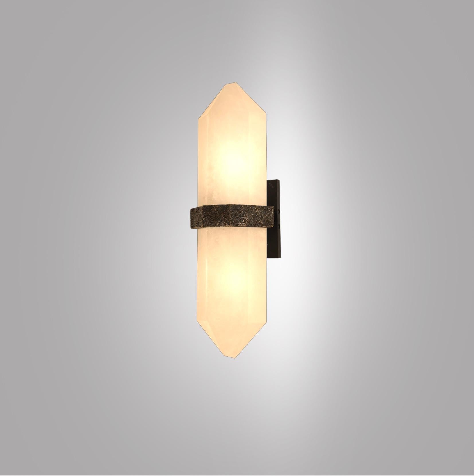 Pair of carved diamond form rock crystal sconces, mount with rich texture of hammered antique brass decoration. Created by Phoenix gallery NYC.
Custom size, finish, and quantity upon request.
Each sconce installs two sockets, 60watts each LED