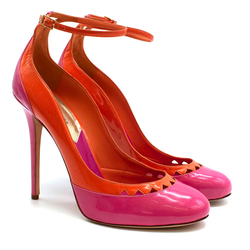 DSquared Pink and Orange Patent Leather Platform Heels

- Orange and pink patent leather heels 
- Rounded toe 
- Cut-out front detailing 
- Ankle strap fastening 
- Leather sole and inner lining 
- Original box and dust bag included 

Materials: