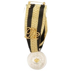 DSQUARED2 Black And Gold Stripe Ribbon Medallion Pin
