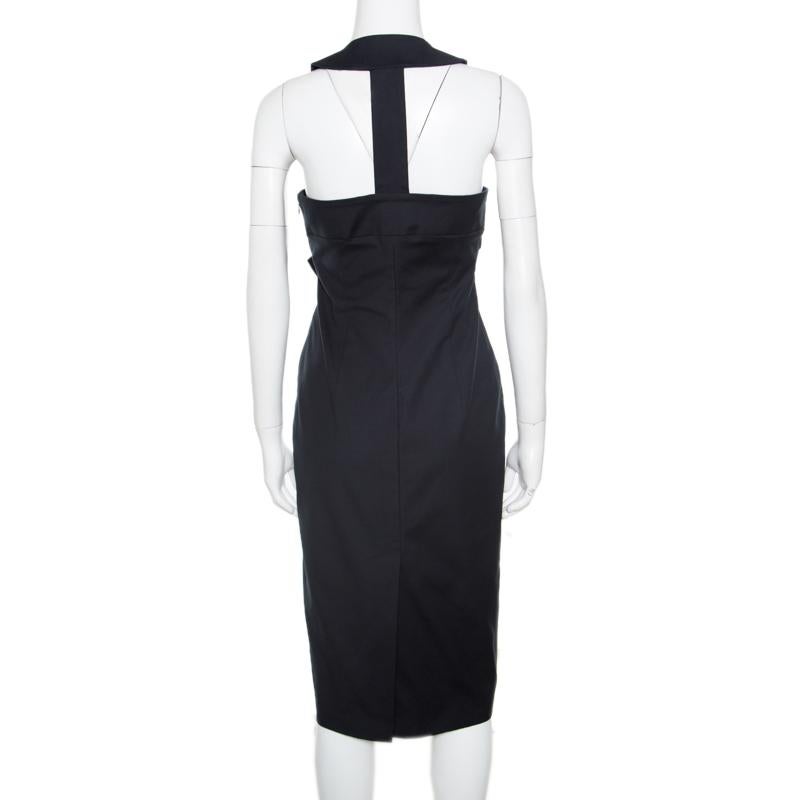 This sleeveless black dress from Dsquared2 exhibits their flair in crafting statement designs. It is made of a cotton blend and features a pretty and feminine satin bow detail at the waistline. It flaunts a plunging neckline and a cutout rear. Pair