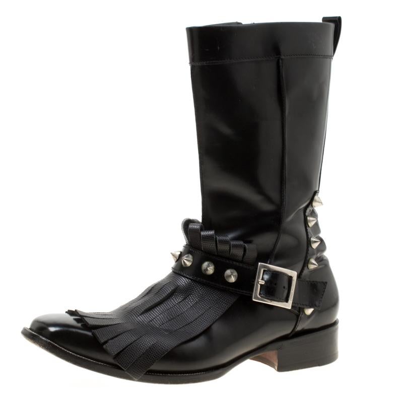 Add a touch of style to your attire with these trendy leather boots. They are from the house of Dsquared2 and designed with fringes and spikes. These fashionable black beauties would go perfectly with jeans and trousers alike.

Includes: The Luxury
