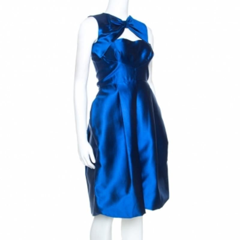 Grab this attractive dress from Dsquared2 to look classy and perfect for every event. Blue in color, the dress is adorned with a  glossy finish all over and is styled with a bow accent as well as a cutout detail near the neckline. It would make you