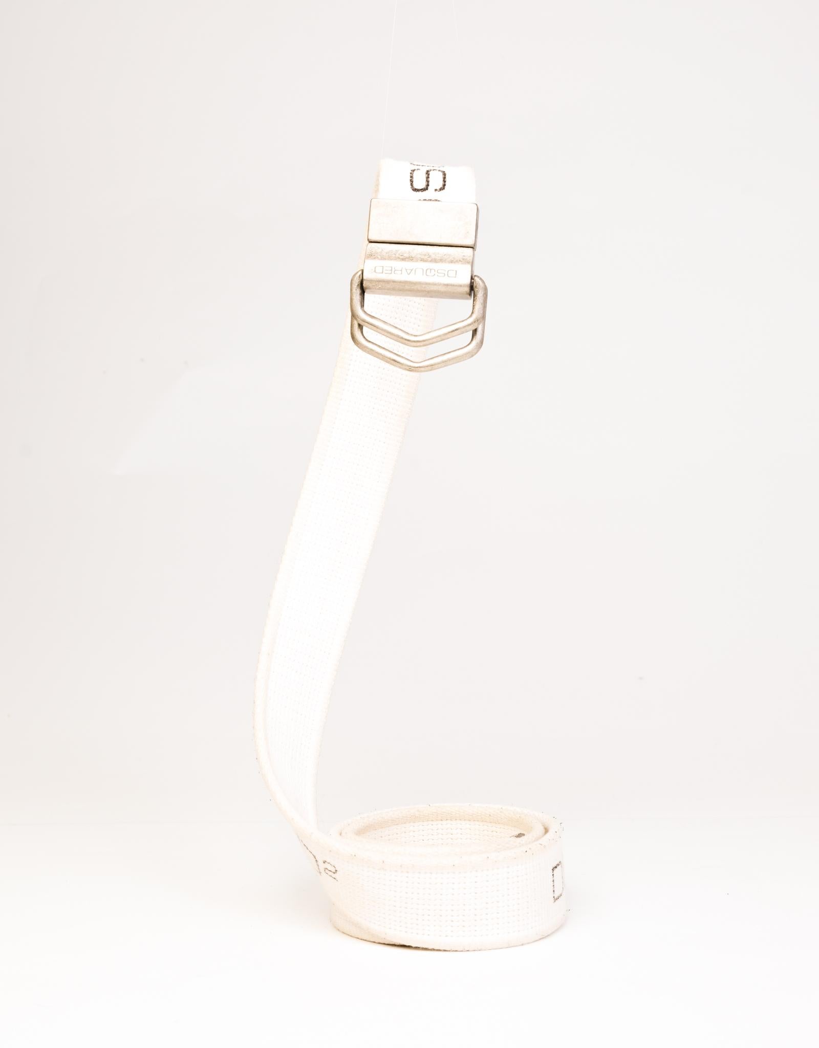 White logo-print slip-through belt from Dsquared2 featuring a grosgrain band, a printed logo, a D-ring buckle, silver-tone aged-style hardware and an adjustable fit.

COLOR: White
MATERIAL: Cloth
MEASURES: L 44” x W 1.5”
CONDITION: Good  - belt