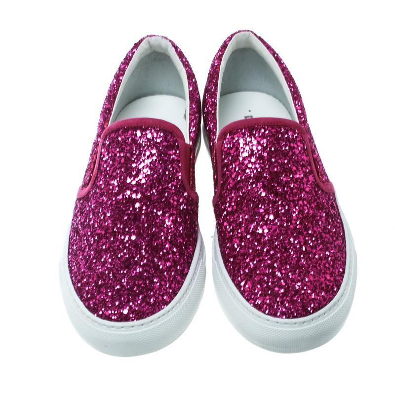 Let your latest shoe addition be this pair of slip-on sneakers from Dsquared2. They've been designed with coarse glitter and styled with suede trims, round toes, comfortable leather insoles, and the brand logo detailed on the counters.

Includes: