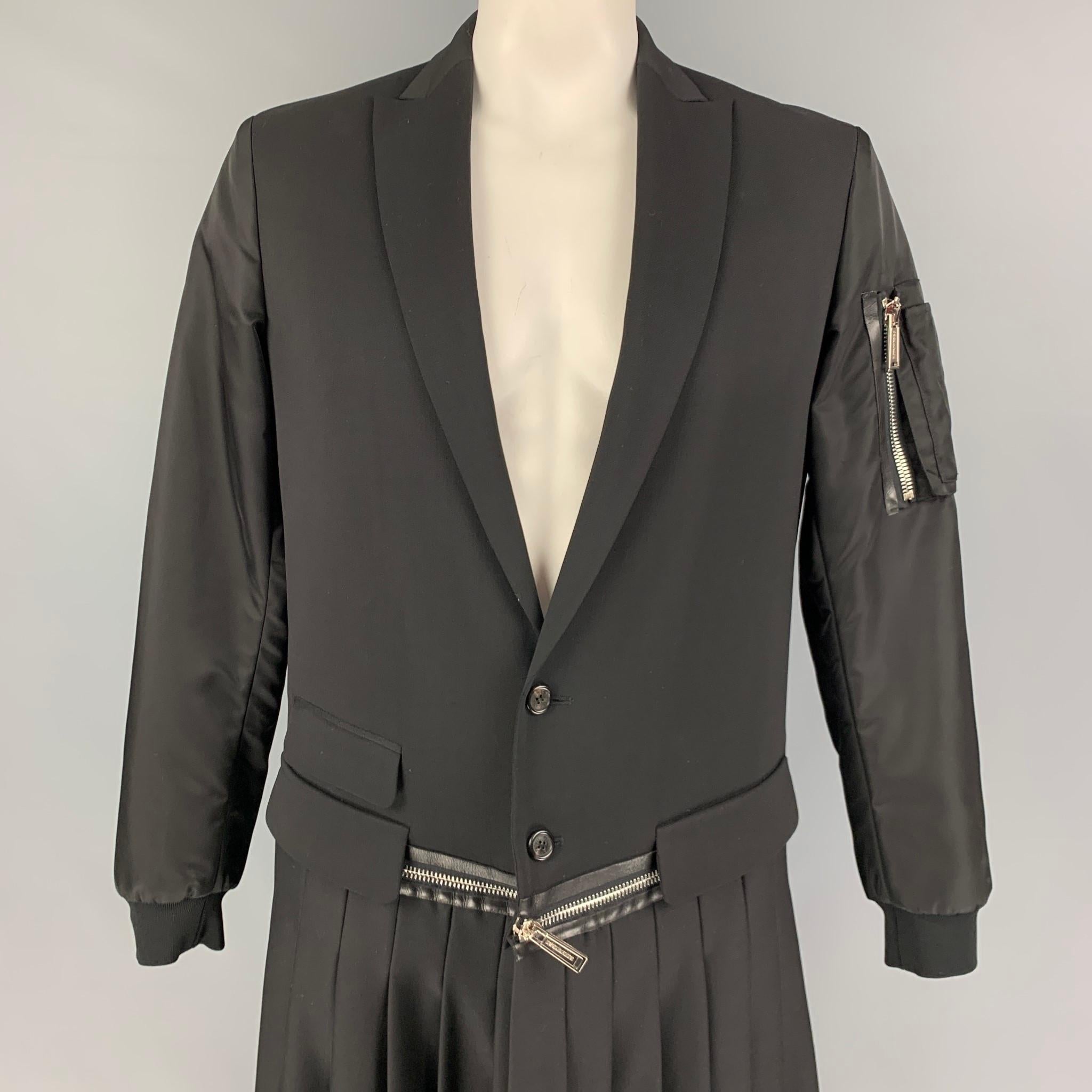DSQUARED2 Fall-Winter 2016 coat comes in a black mixed fabrics featuring a peak lapel, bomber sleeves, detachable pleated skirt design, and a double button closure. Made in Italy. 

Excellent Pre-Owned Condition.
Marked: 48

Measurements:

Shoulder: