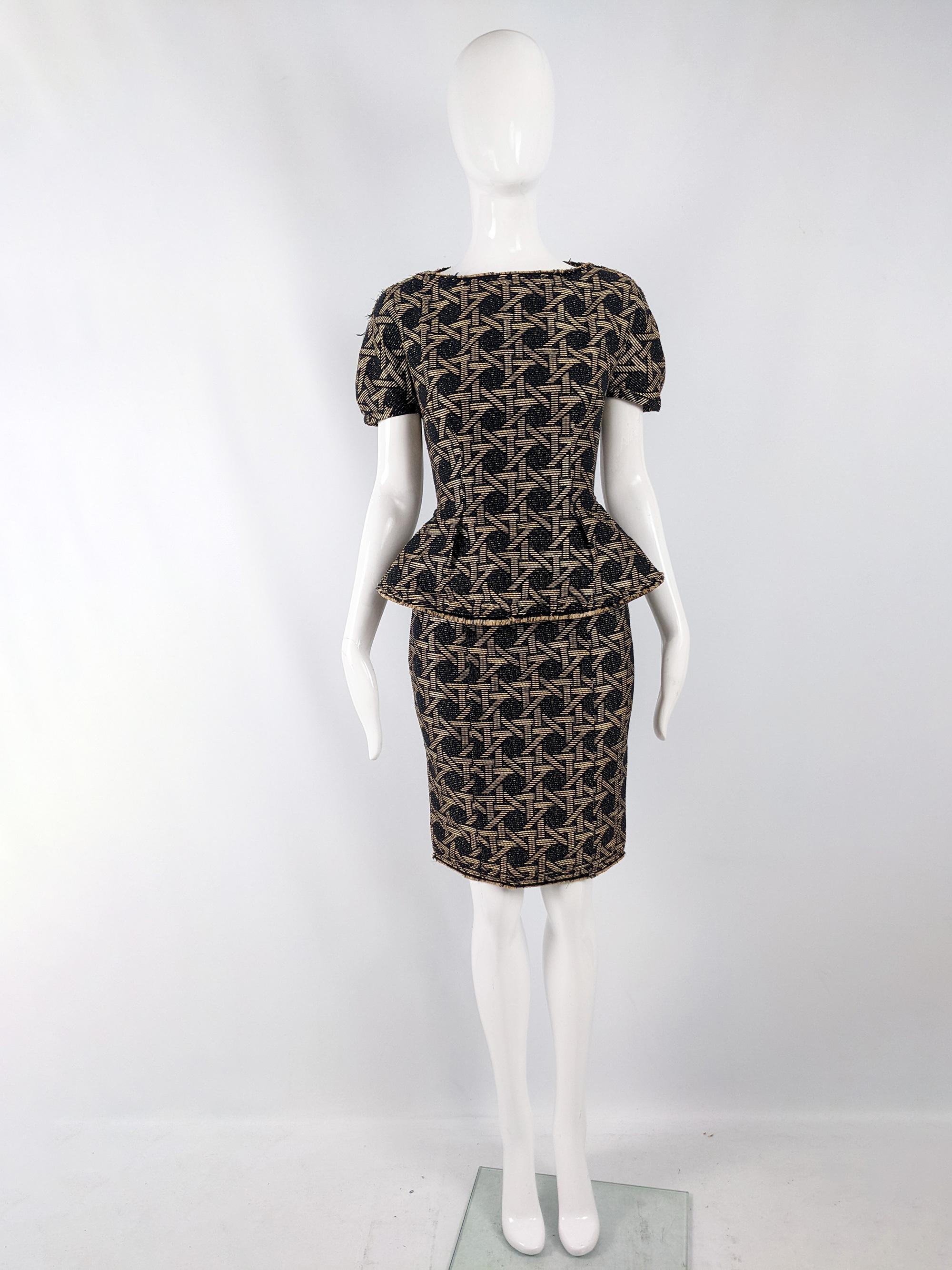 An incredible and rare preowned womens Dsquared2 dress from the Resort 2014 collection. In a black and tan woven fabric (almost like a synthetic raffia fabric) with intentional distressed raw edges and incredible structure. It has a scupltural