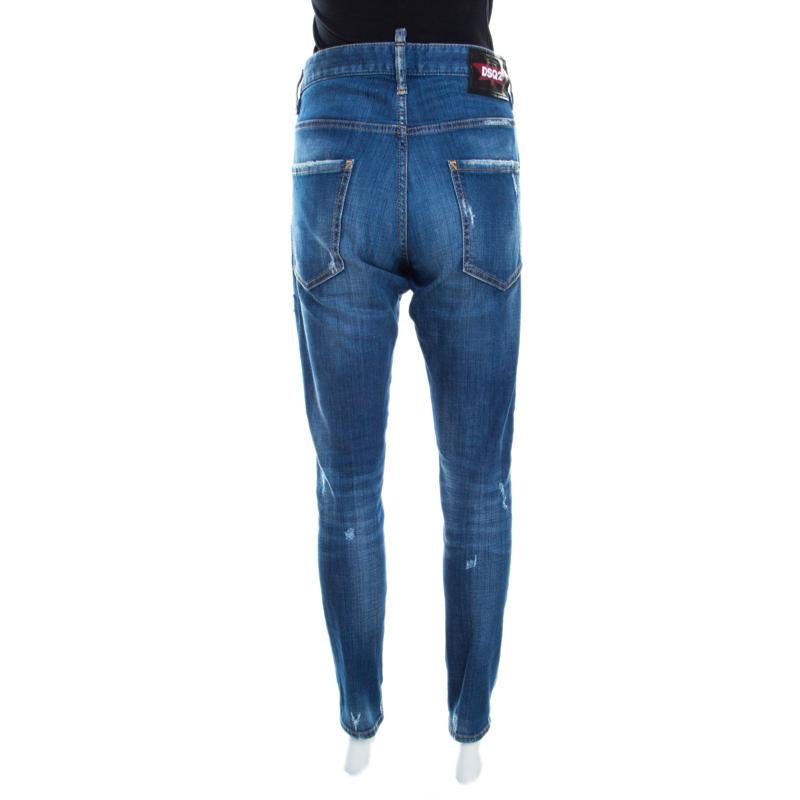 This amazing casual wear is the creation of Dsquared2, made in the classic blue with a faded effect. This pair of tapered jeans are tailored from cotton blends that provide a great fit. This distressed denim piece features ruffled design near the
