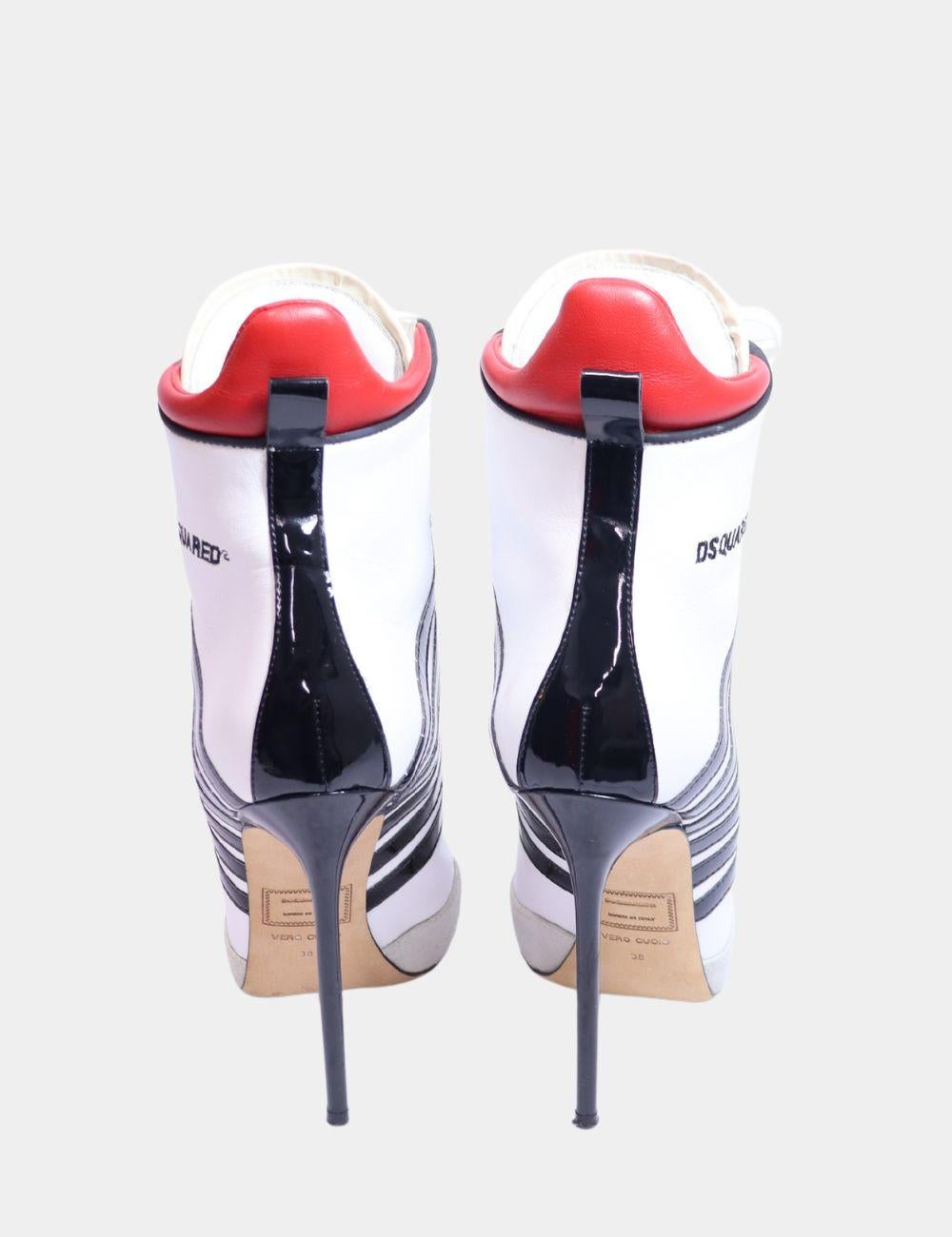 DSQUARED2 Julie High Heel Boots, features a almond toe, front lace up detail, logo patch at the tongue, appliqué stripes at the sides, high stiletto heel, and an embroidered logo to the side.

Material: Leather 
Size: EU 38
Heel: 12cm
Overall