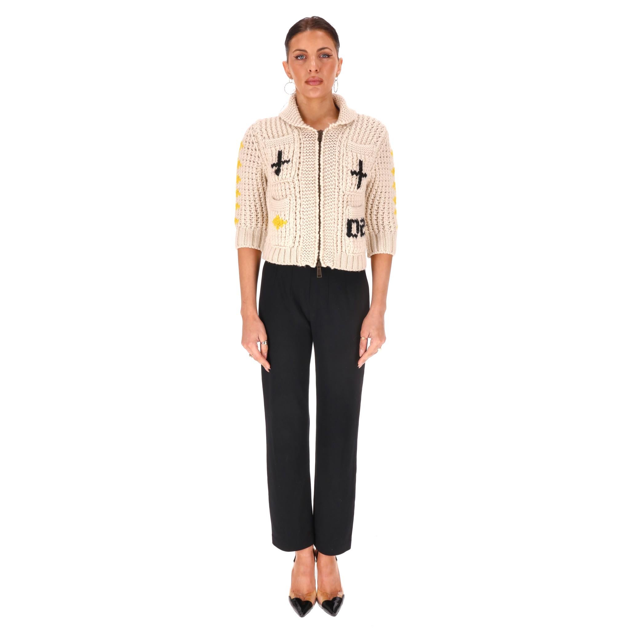 Dsquared2 Knitted Wool Zipped Cardigan 

From faith/religious inspired 2015 collection is this heavily knitted wool cardigan.

Featuring crosses and church embroidered motifs.

Collared neckline, patch pockets and cropped fit design.

Rrp Approx.