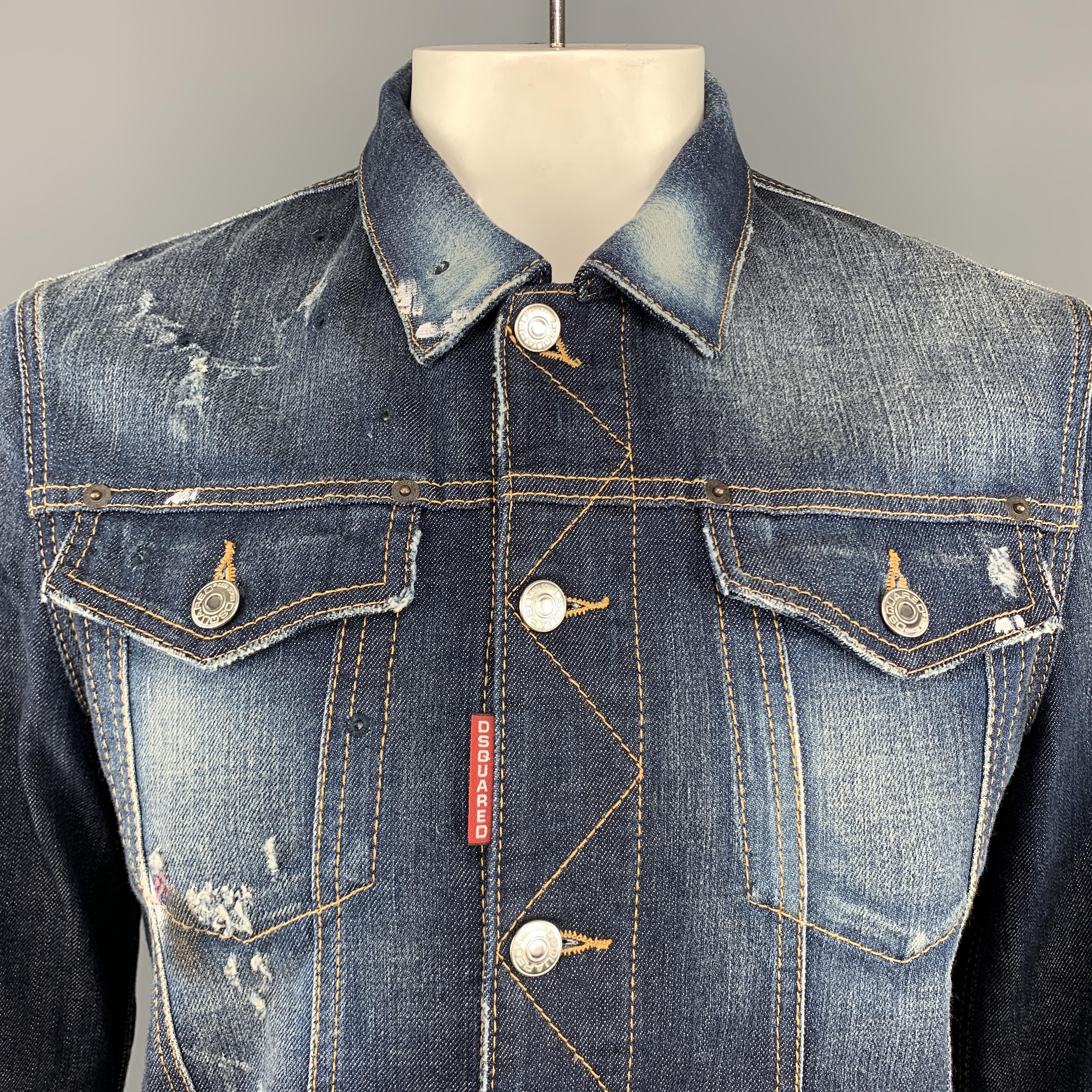 DSQUARED2 trucker jacket comes in washed effect indigo denim with all over distressed effects, tears, eyelet embroidery, and paint splatter details. Made in Italy.

Excellent Pre-Owned Condition.
Marked: IT 52

Measurements:

Shoulder: 17 in.
Chest: