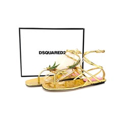 Dsquared2 Marija – Flache Sandalen mit Blatt-Wickel-Design aus goldfarbenem Lackleder mit Spiegelglanz, Größe 39