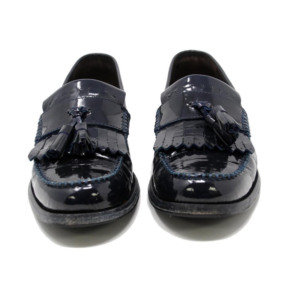 Dsquared2 Navy Blue Patent Leather Stitch Tassel Mens Penny Loafers Formal Shoes

These navy blue leather classic tassel formal loafers are a staple piece from the collection and feature a round toe, a flat sole, a slip-on style, tassel detailing