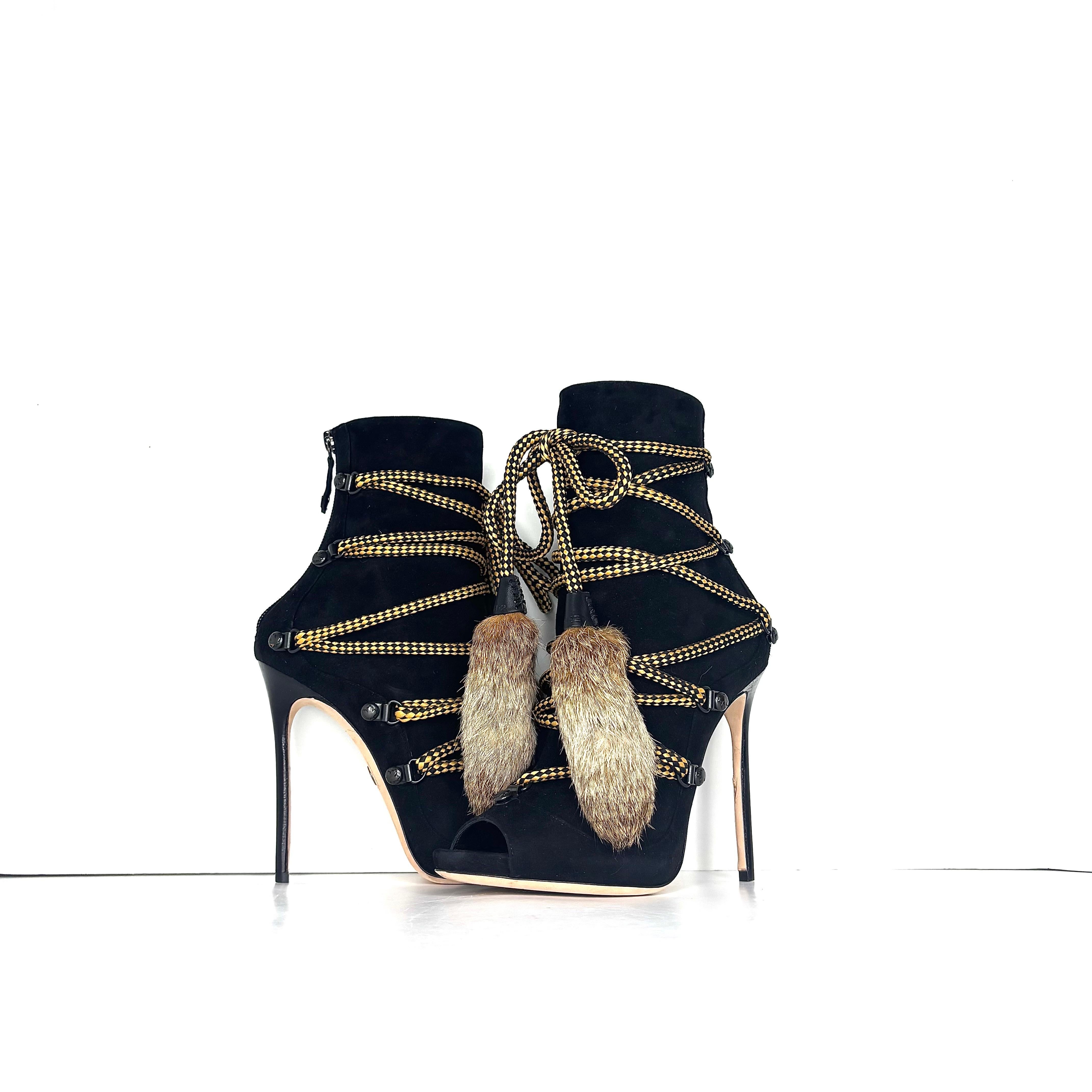 Dsquared2 Fur Tassel Strappy Peep Toe Bootie
Color Multi
Size 37EU
Suede upper
Leather sole
D ring laceup with rabbit fur tassels
High stiletto heel
4in heel height
Back heel zip up
Signs of normal wear, very good overall condition


Trending,