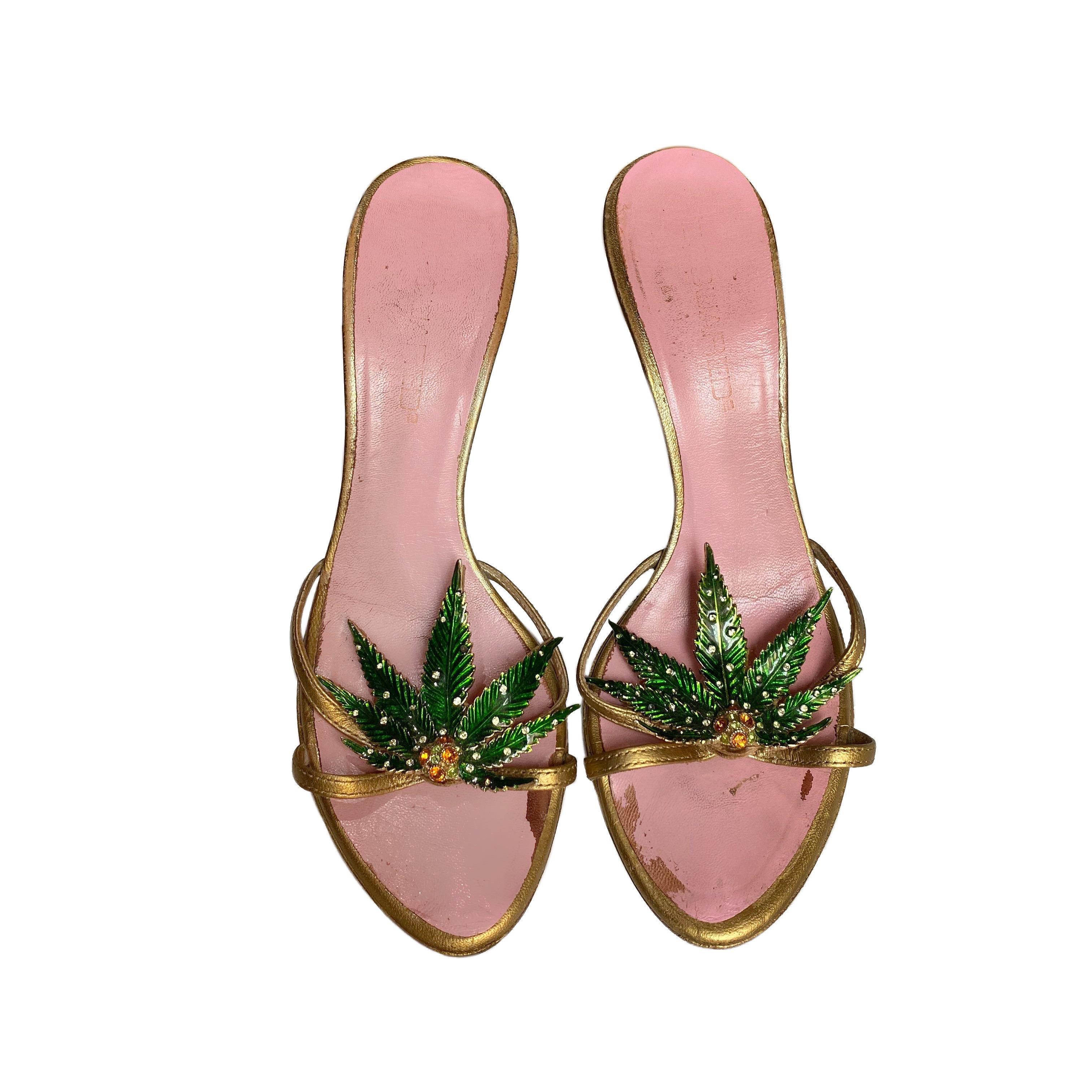 Dsquared2 gold leather heels with green metal Marijuana leaf Plaque with rhinestones from the Spring/Summer 2005 collections. Similar version featured on the runway.

Size 36

The item has some scratches on the heel and inner sole (pictured), it has