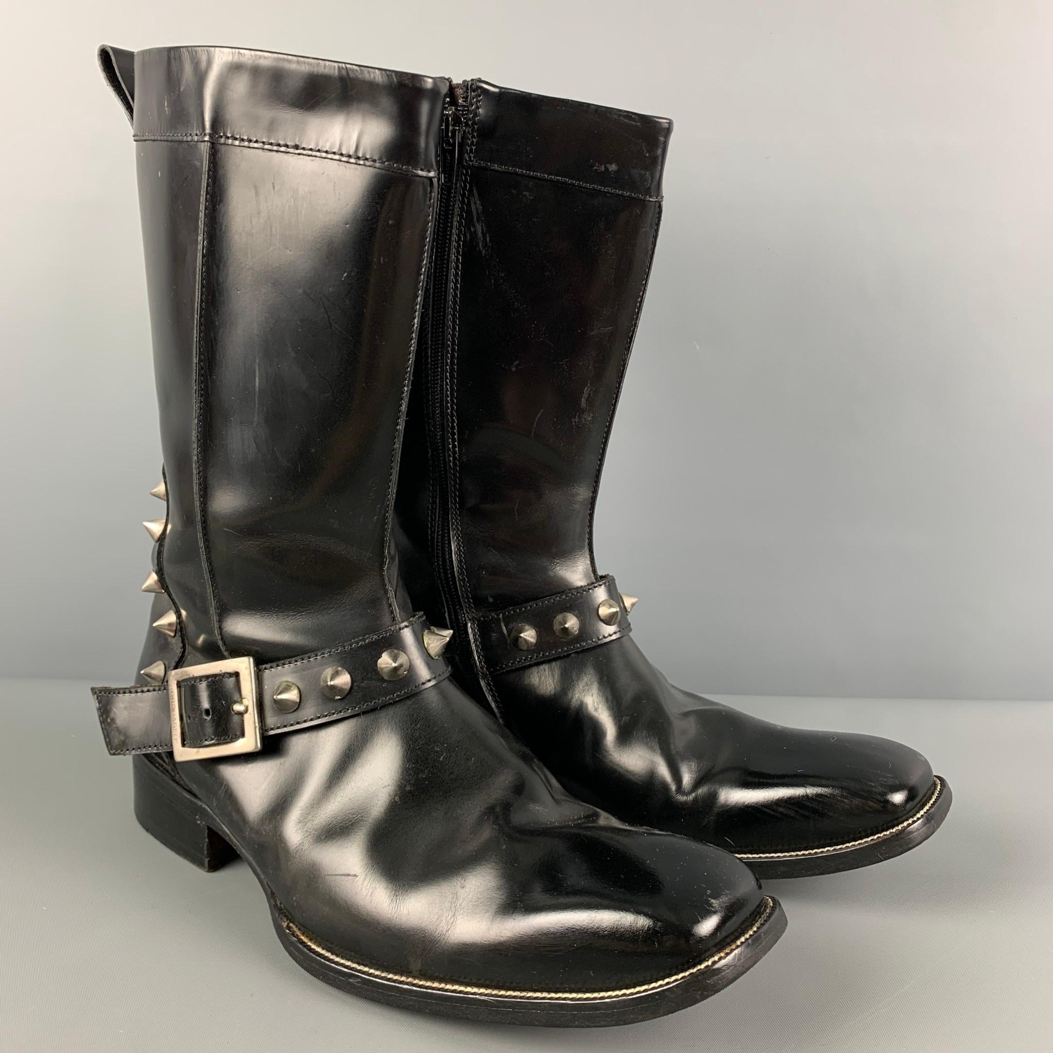 DSQUARED2 boots comes in a black leather featuring a square toe, silver tone studded details, strap detail, chunky heel, and a side zipper closure. Made in Italy. 

Very Good Pre-Owned Condition. Light wear throughout. As-is.
Marked: 43
Original