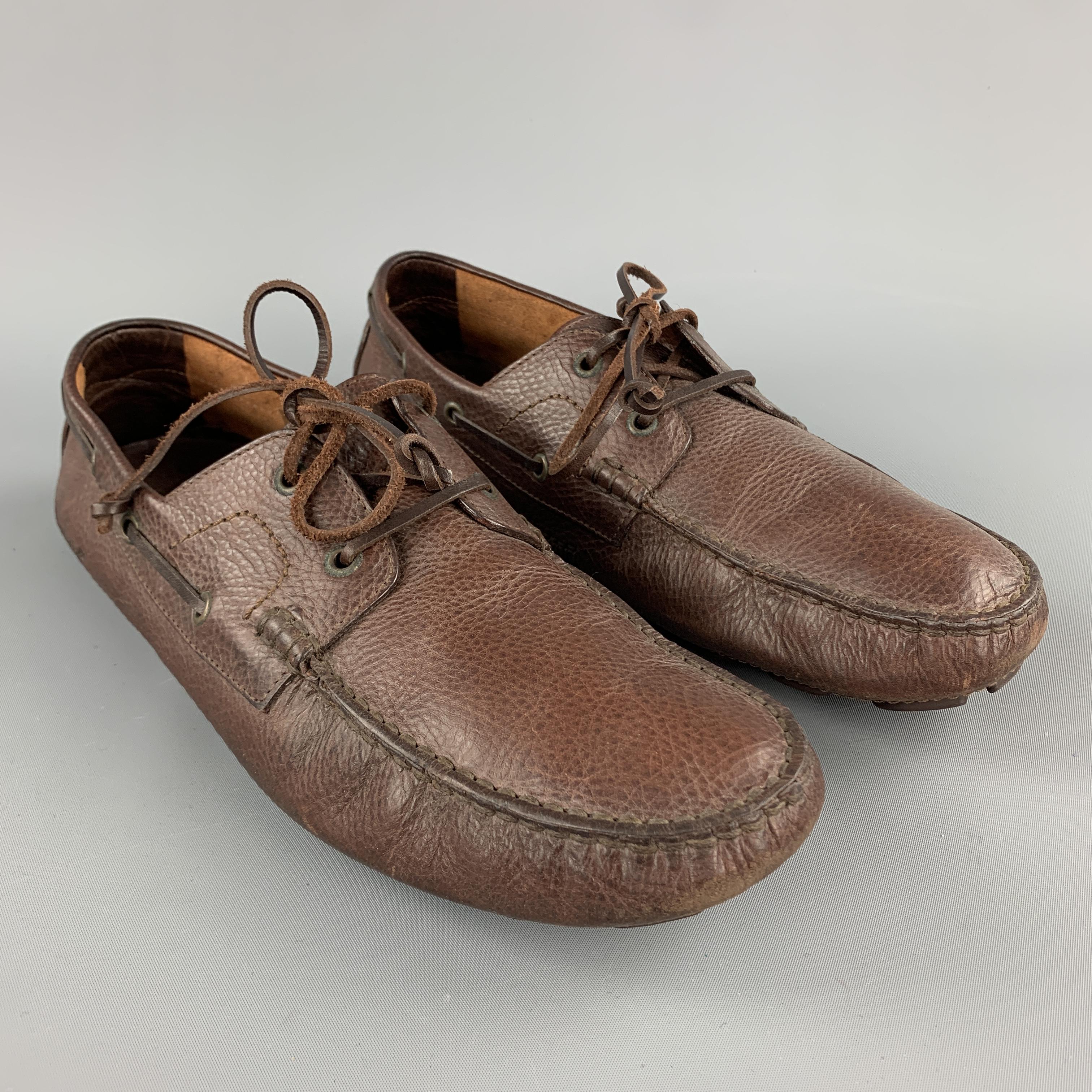 DSQUARED2 loafers come in brown leather with woven tie up front. Made in Italy.

Excellent Pre-Owned Condition.
Marked: IT 43

Outsole: 11.75 x 3.5 in.