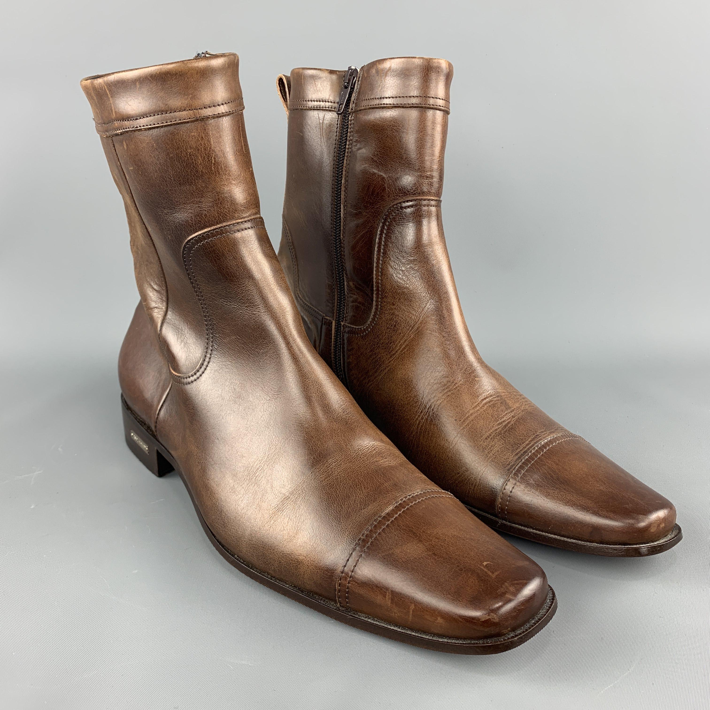 DSQUARED2 dress boots come in antique effect leather with with a cap toe, metal logo detailed heel, and inner zip. Made in Italy.
 
Very Good Pre-Owned Condition.
Marked: IT 43.5
 
Outsole: 12.5 x 4 in.
Length: 8.75 in.