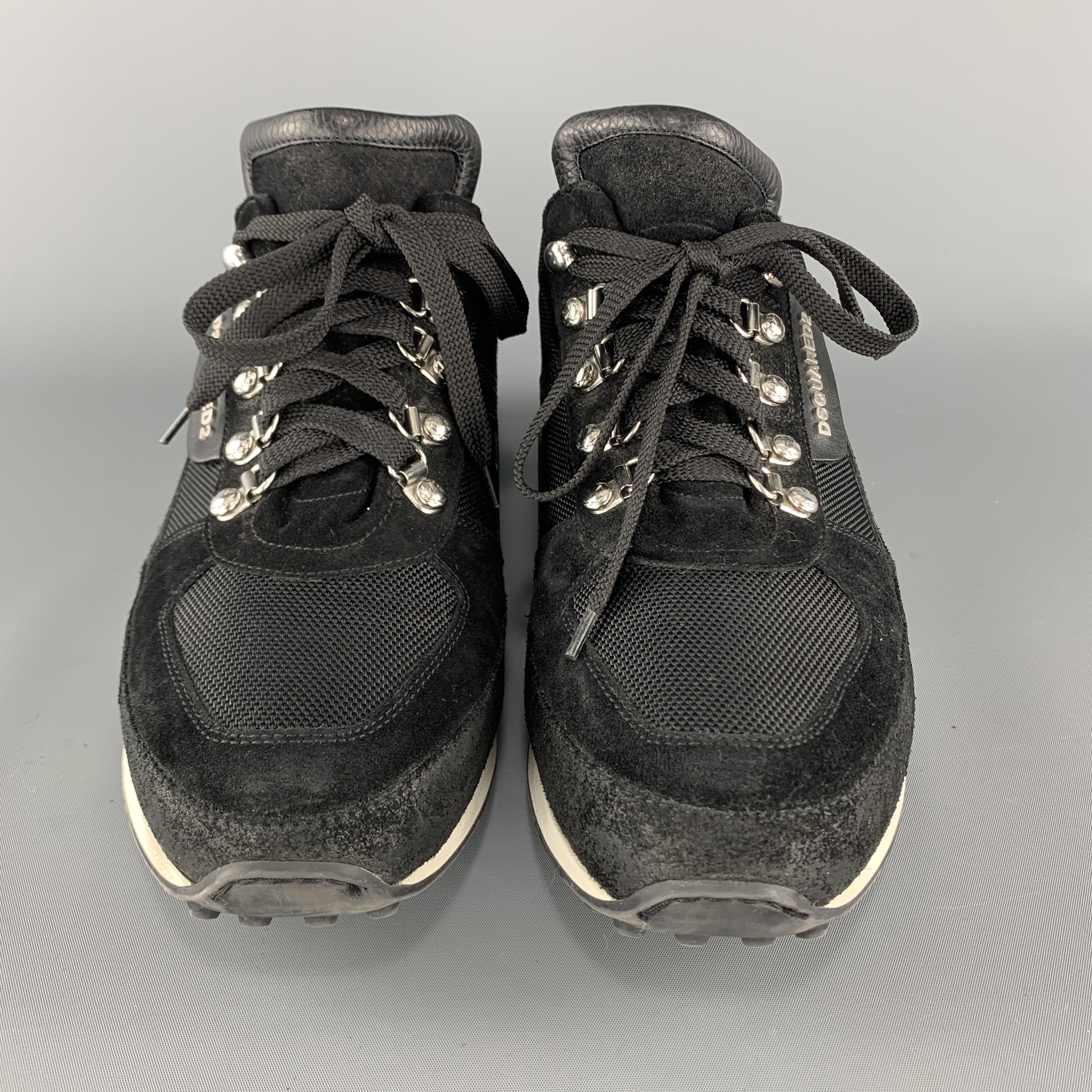 DSQUARED2 sneakers come in black canvas with leather and suede panels, lace up front with silver tone ski hooks, and white sole. Made in Italy.

Very Good Pre-Owned Condition.
Marked: IT 45

Outsole: 12.25 x 4 in.
