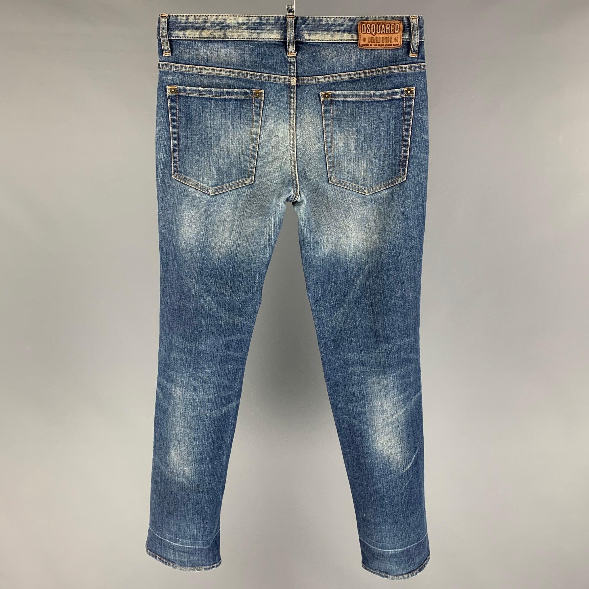 DSQUARED2 jeans comes in a indigo distressed cotton featuring a skinny fit, contrast stitching, and a button fly closure. Made in Italy.
Very Good
Pre-Owned Condition. 

Marked:   46 

Measurements: 
  Waist: 32 inches Rise:
9 inches  Inseam: 30