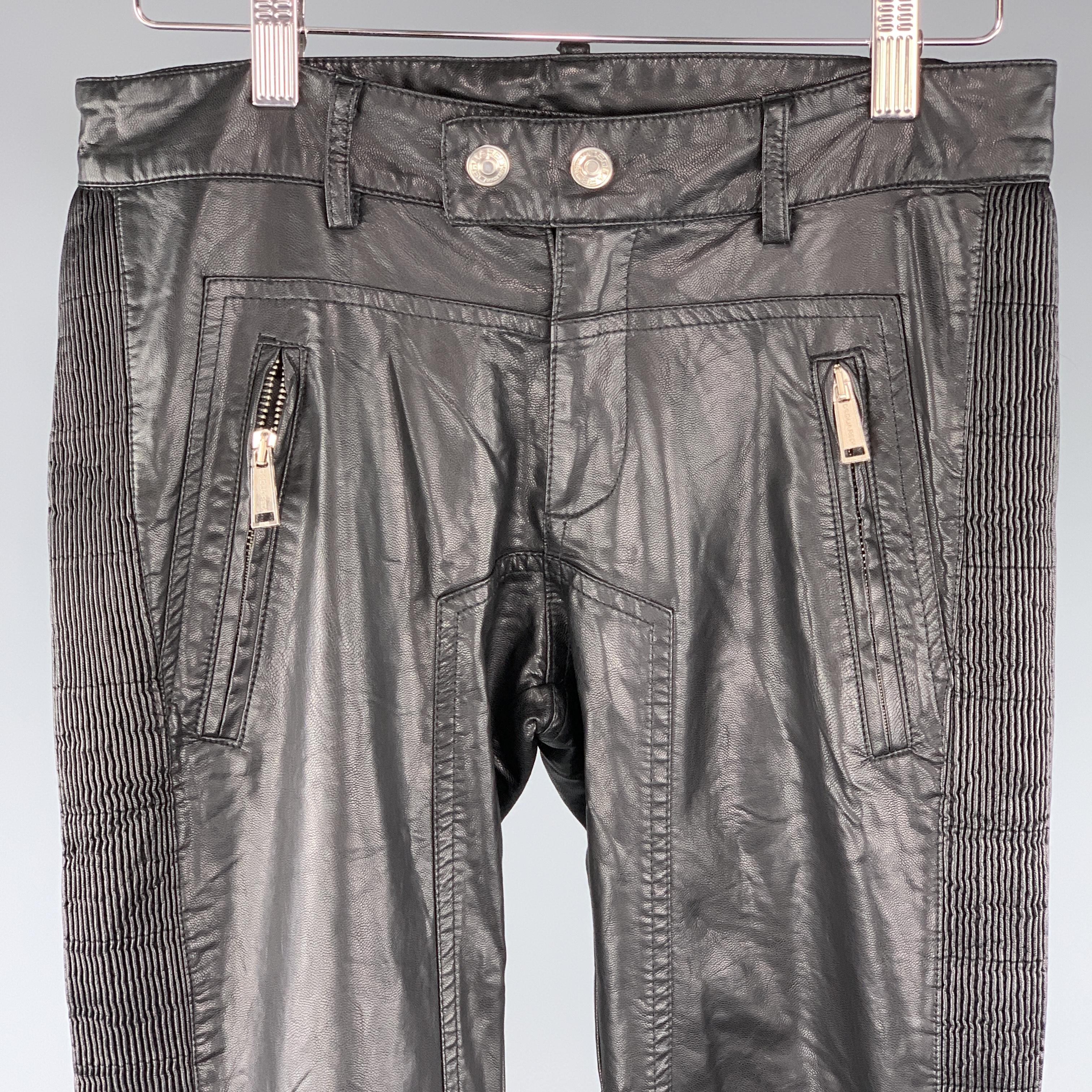 DSQUARED2 pant comes in a back pleather featuring a biker style, stitch details throughout, zip pockets, a side leg tuxedo detail, and a double button closure. Made in Italy.
 
Excellent Pre-Owned Condition.
Marked: 30
 
Measurements:
 
Waist: 32