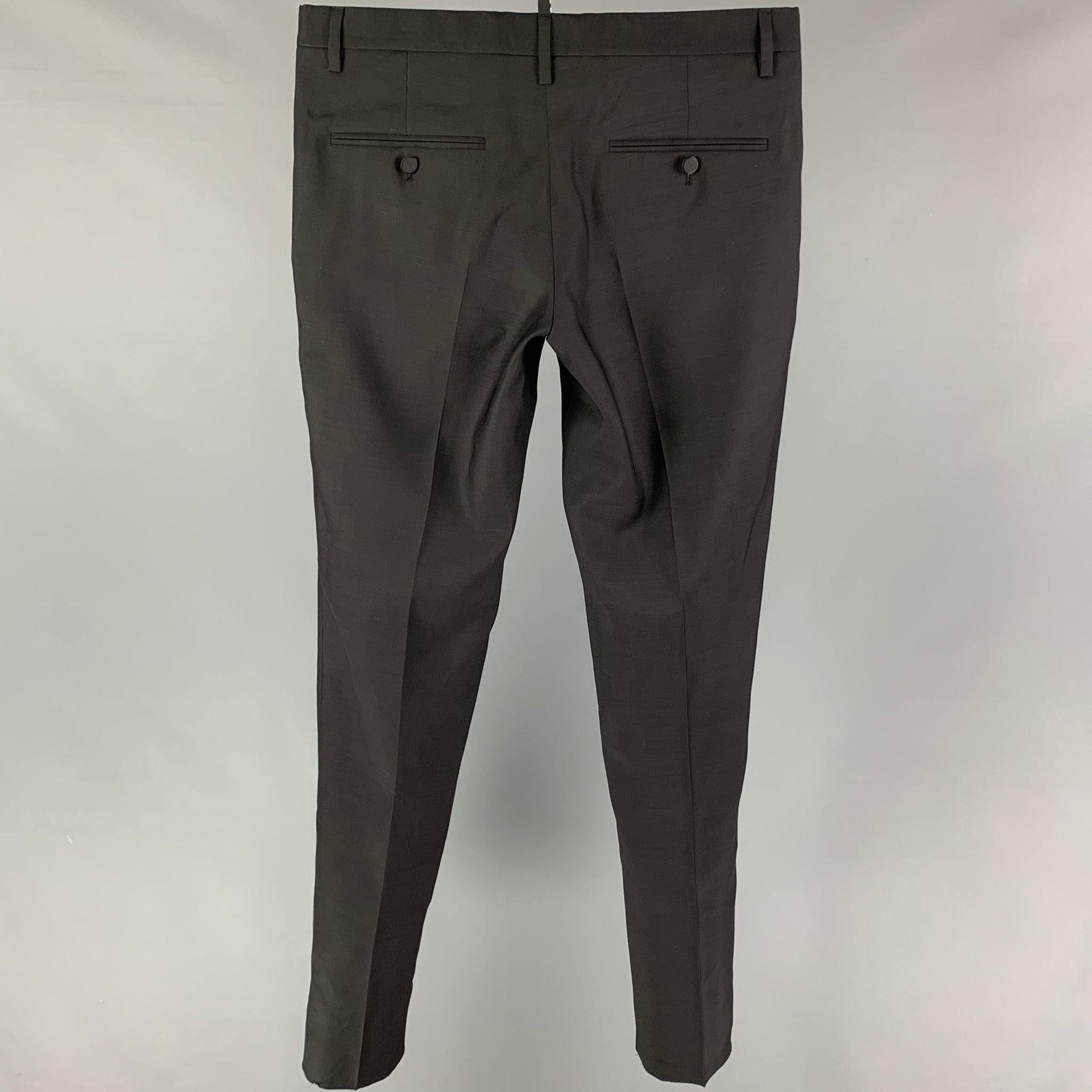 DSQUARED2 dress pants comes in a black cotton / silk featuring a slim fit, front tab, and a buttno fly closure. Made in Italy.
Very Good
Pre-Owned Condition. 

Marked:   48 

Measurements: 
  Waist: 34 inches  Rise: 10 inches  Inseam: 36 inches 
  
