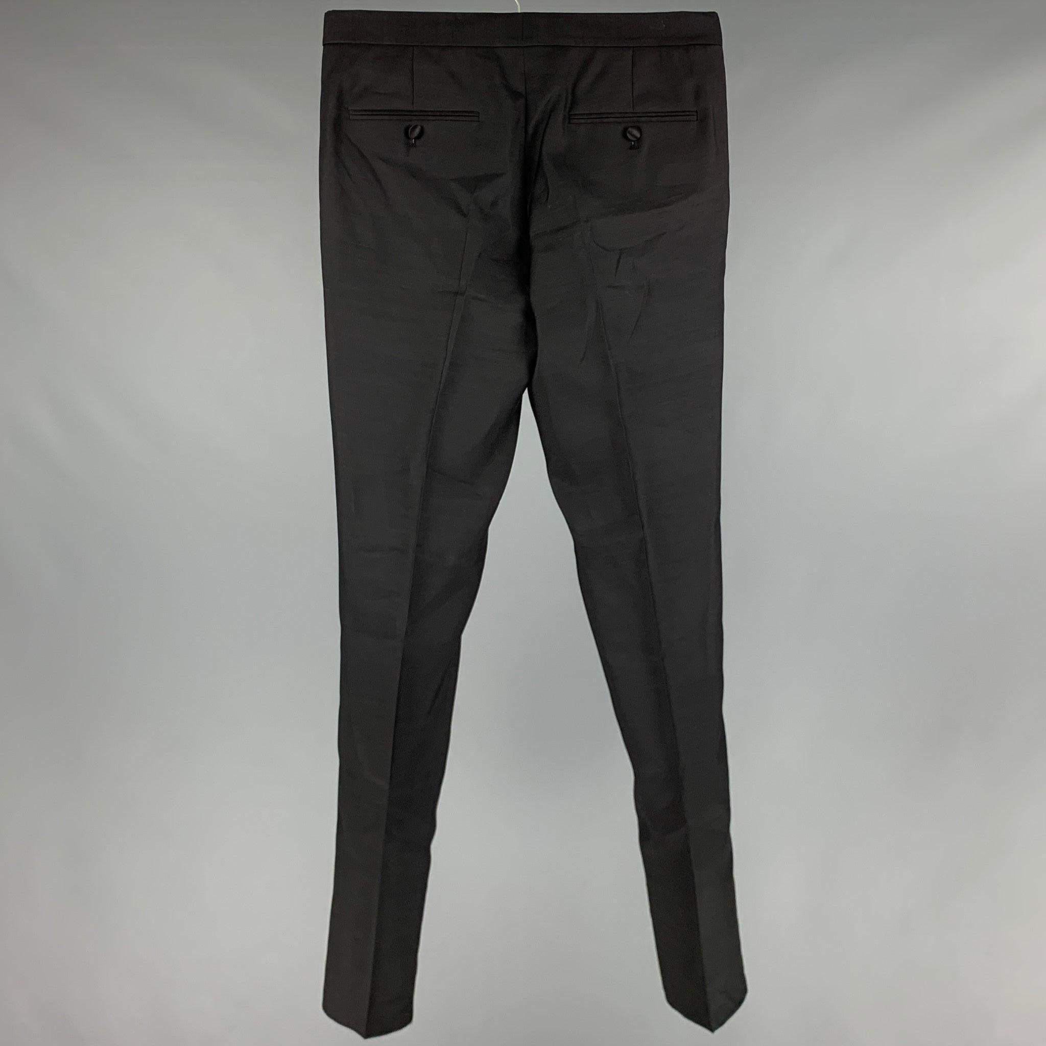 DSQUARED2 dress pants
in a
black wool blend fabric featuring side tabs, and a button fly closure. Made in Italy.New With Tags. 

Marked:   48 

Measurements: 
  Waist: 32 inches Rise: 9 inches Inseam: 34 inches Leg Opening: 12.5 inches 
  
  
