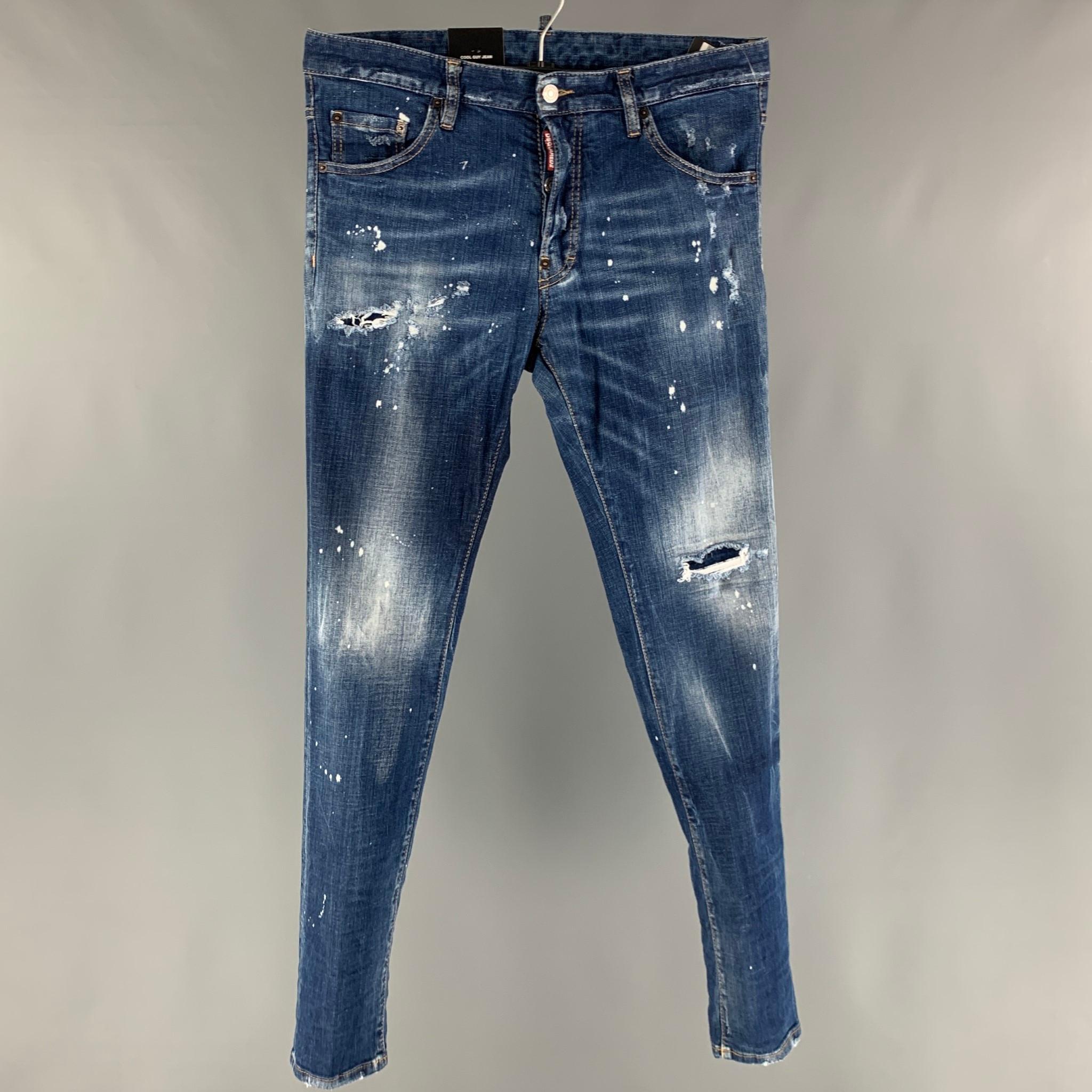 DSQUARED2 jeans comes in an indigo distressed cotton and elastane denim featuring a long crotch, paint splatter details, contrast stitching, and a button fly closure. Made in Italy.

New with Tags.
Marked: 48

Measurements:

Waist: 34 in.
Rise: 9
