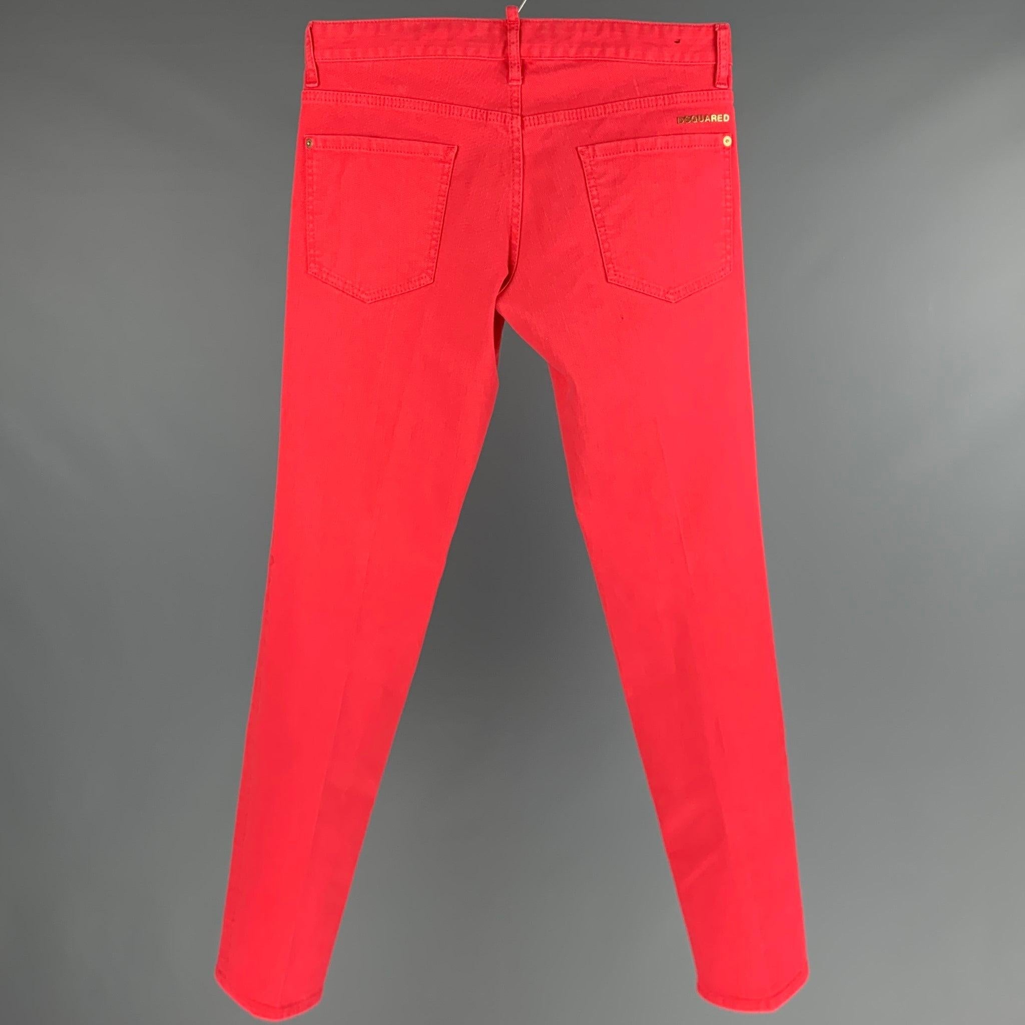 DSQUARED2 jeans
in a red cotton blend fabric featuring gold tone hardware, five pockets style, and button fly closure. Made in Italy.Very Good Pre-Owned Condition. Minor mark. 

Marked:   48 

Measurements: 
  Waist: 32 inches Rise: 7 inches Inseam: