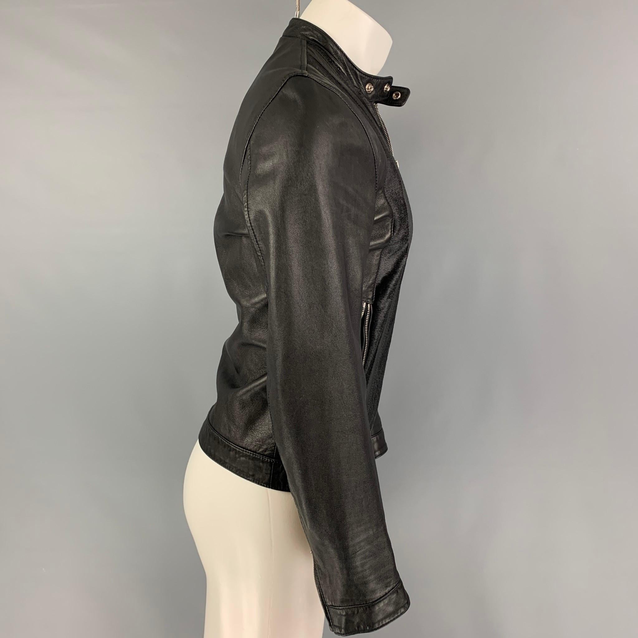 DSQUARED2 jacket comes in a black leather featuring a textured panel detail, zipped cuffs, zipper pockets, and a full zip up closure. Made in Italy. 

Good Pre-Owned Condition. Missing zipper detail. As-Is.
Marked: 46

Measurements:

Shoulder: 17