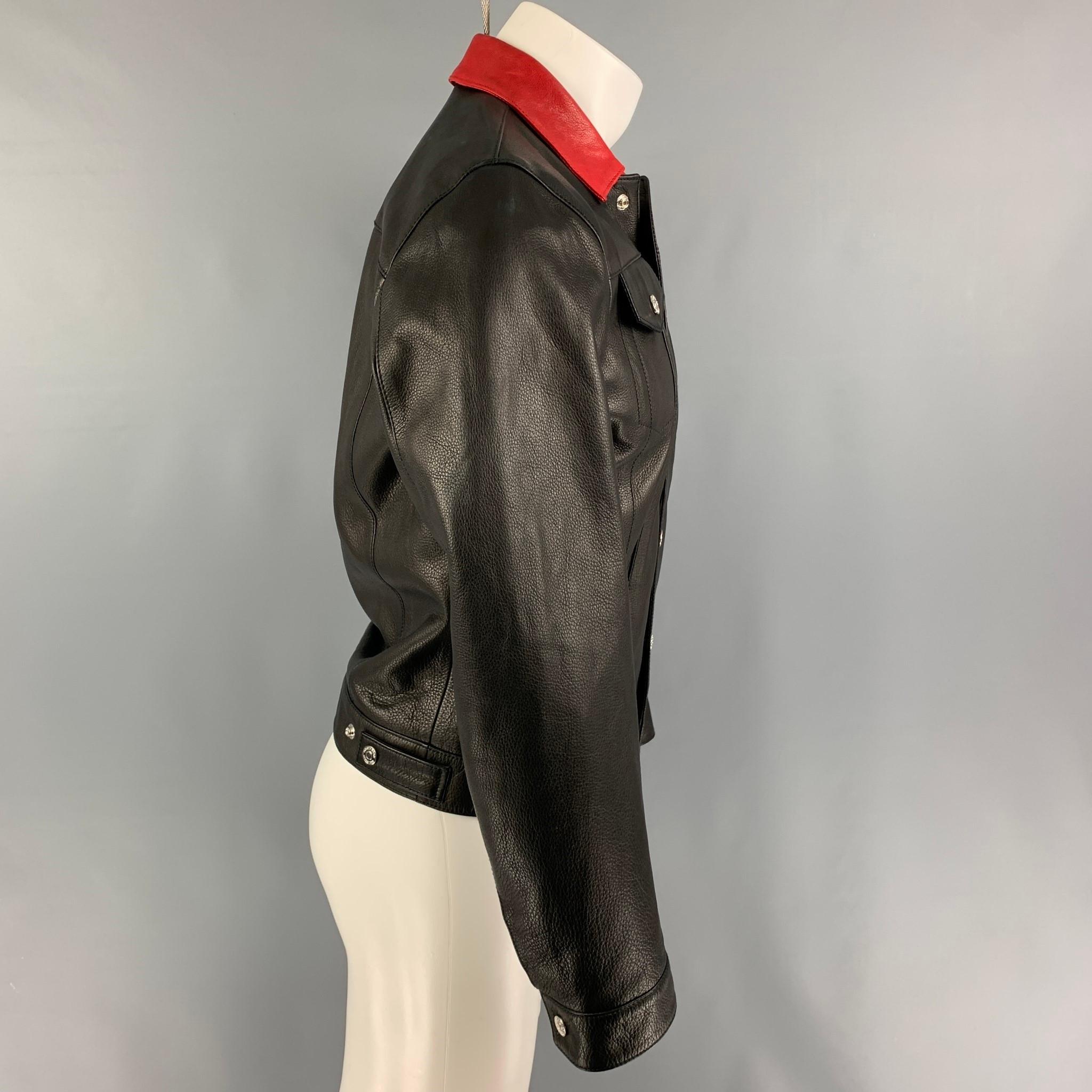 DSQUARED2 jacket comes in a black leather with a full liner featuring a trucker style, red collar, front pockets, and a snap button closure. Made in Italy. 

Good Pre-Owned Condition. Moderate discoloration at back.
Marked: