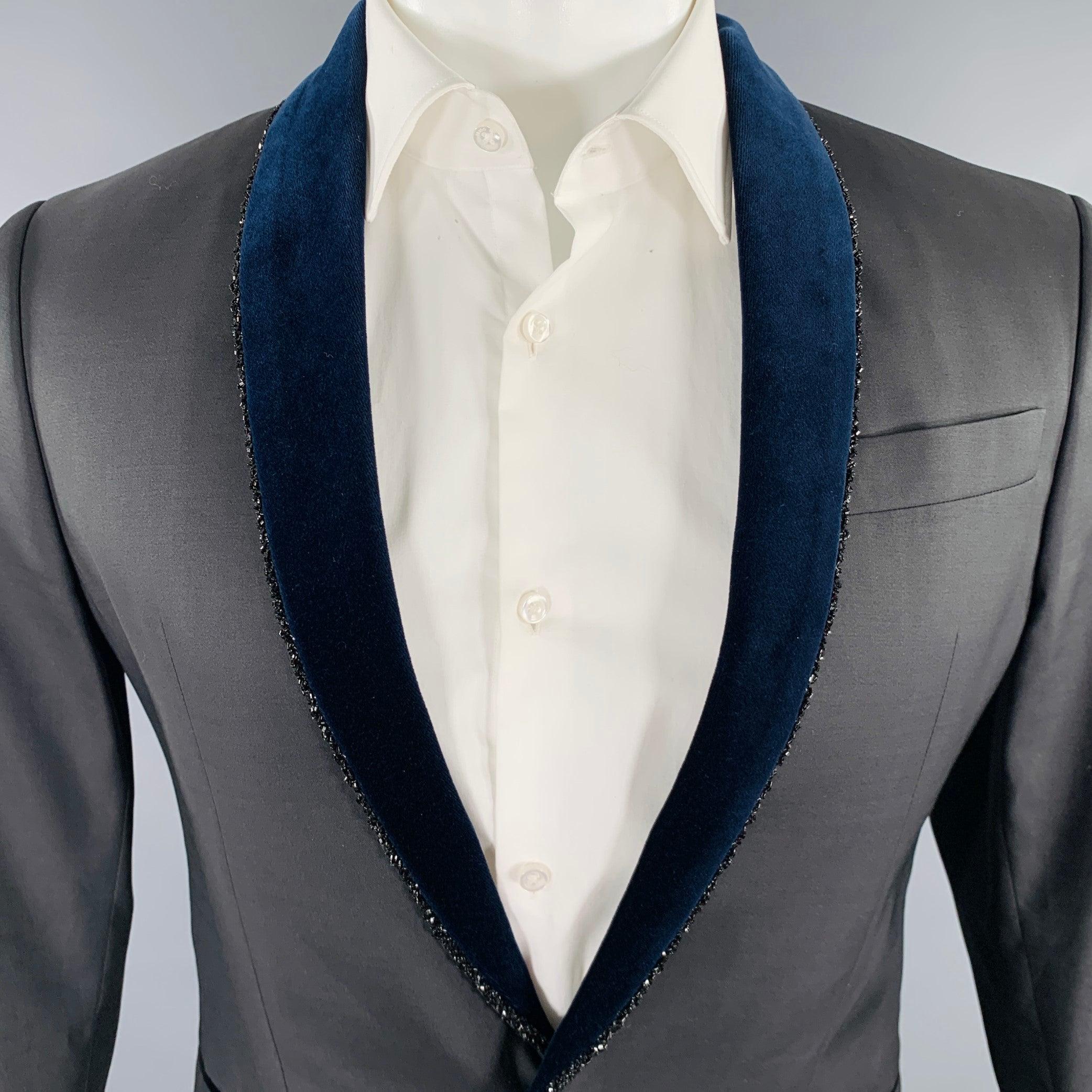 DSQUARED2 TOKYO sport coat
in a black wool silk featuring a navy velvet shawl collar with beaded trim, single vented back, and single button closure. Excellent Pre-Owned Condition. 

Marked:   IT 48 

Measurements: 
 
Shoulder: 16.5 inches Chest: 38