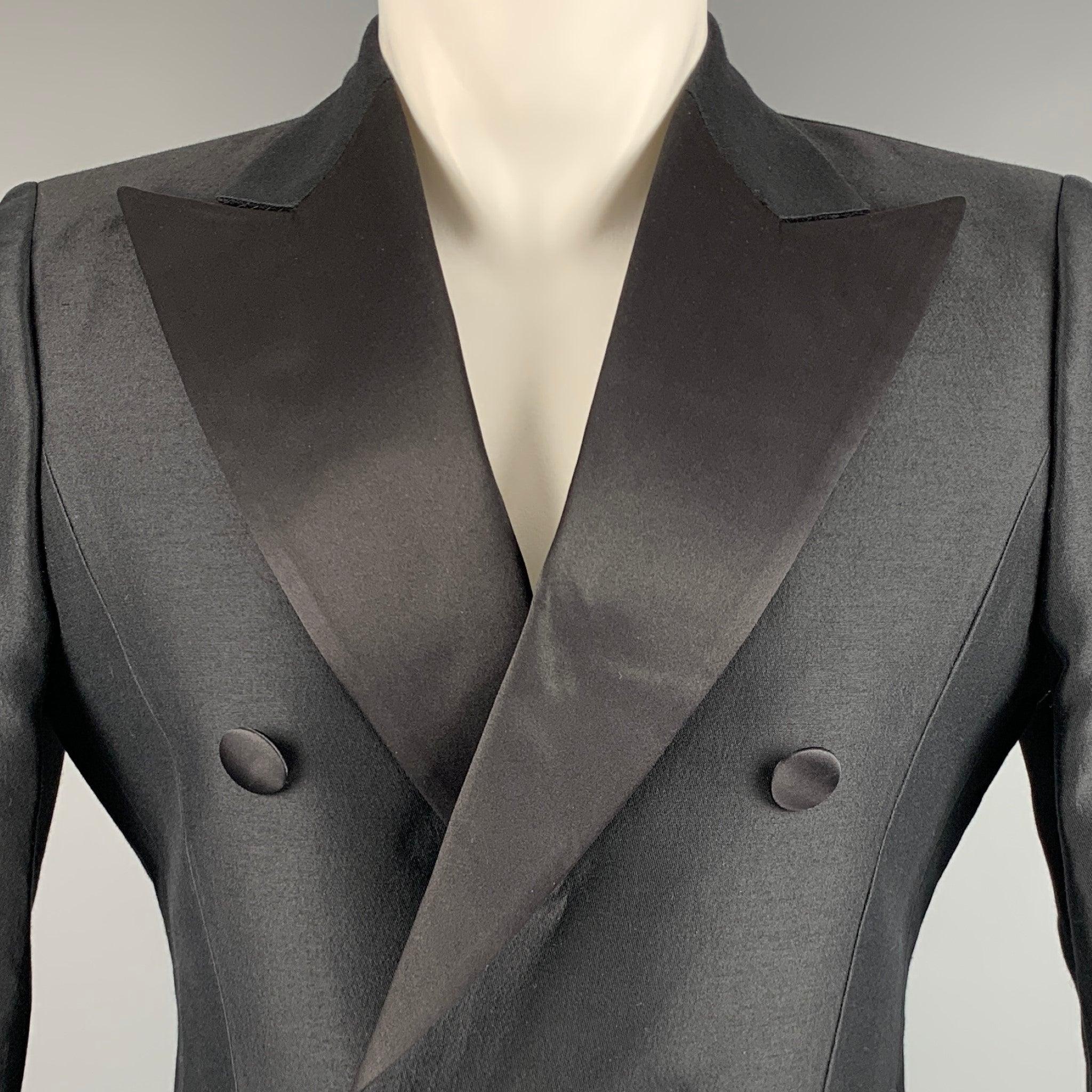 DSQUARED2 tuxedo sport coat in a black wool silk blend fabric featuring a double breasted style, peak lapel, double vented back, and single button closure. Made in Italy.Very Good Pre-Owned Condition. Minor marks. 

Marked:   IT 48 

Measurements: 
