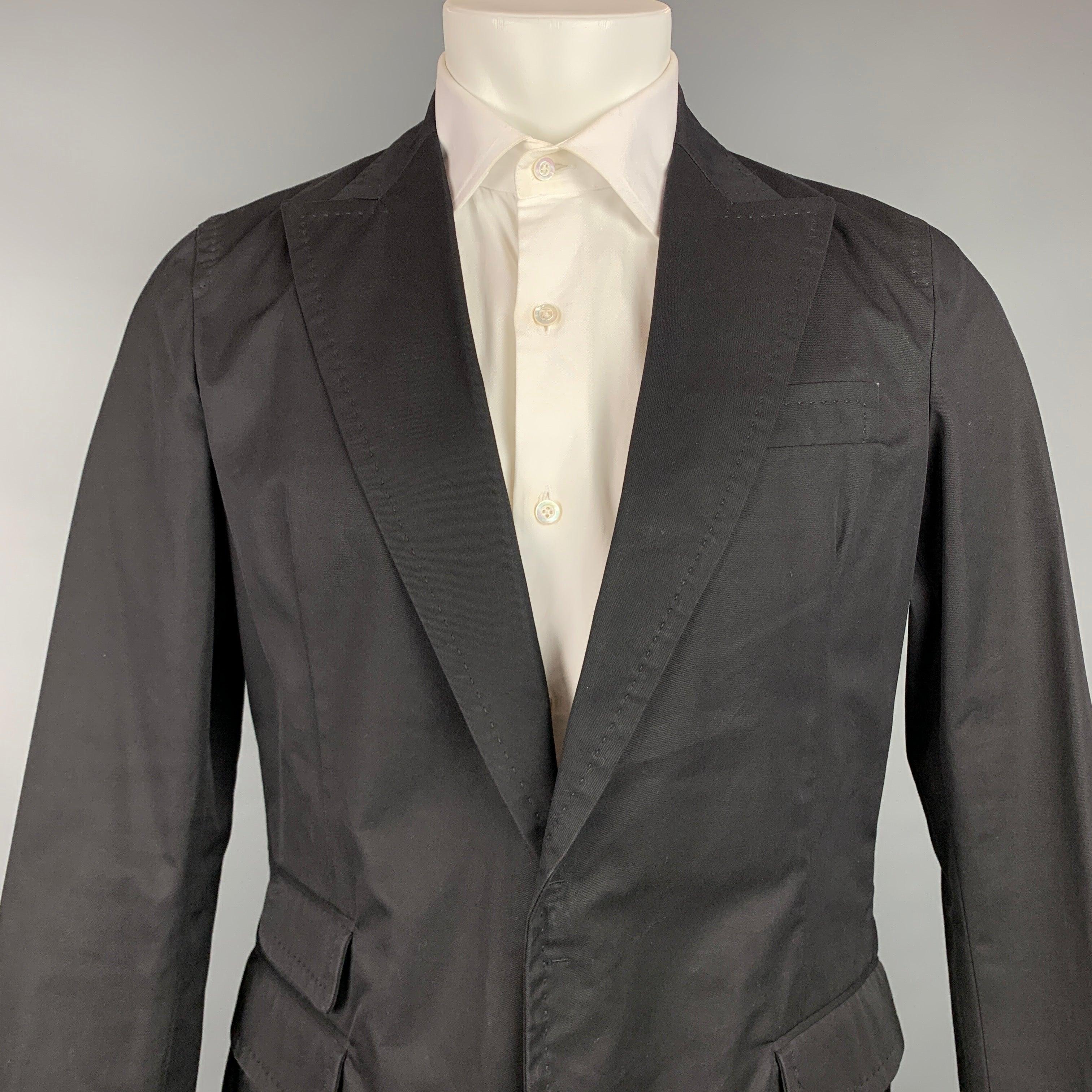 DSQUARED2
sport coat comes in a black cotton with a half pink monogram liner featuring a peak lapel, flap pockets, and a hook & eye closure. Made in Italy.Very Good Pre-Owned Condition. 

Marked:   50 

Measurements: 
 
Shoulder: 16.5 inches  Chest: