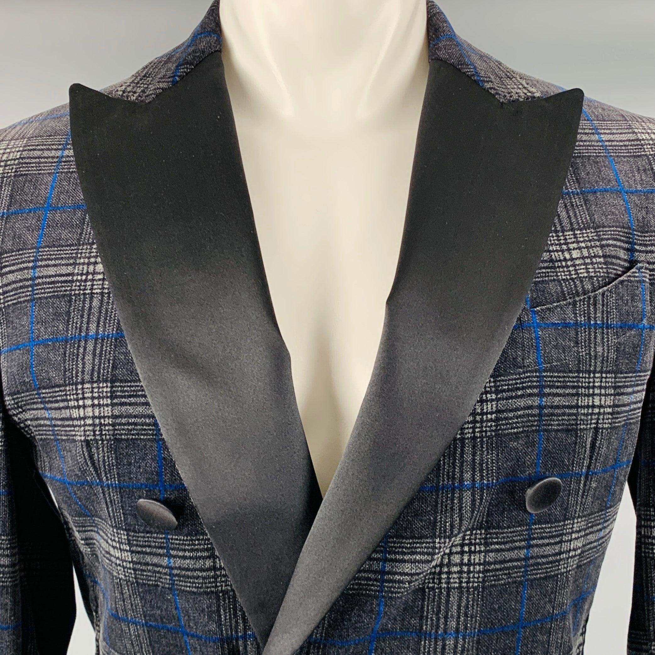 DSQUARED2 sport coat
in a black and grey cotton blend fabric featuring a plaid pattern, peak lapel, single vented back, and a double breasted double button closure. Made in Italy.Excellent Pre-Owned Condition. 

Marked:   50 

Measurements: 
