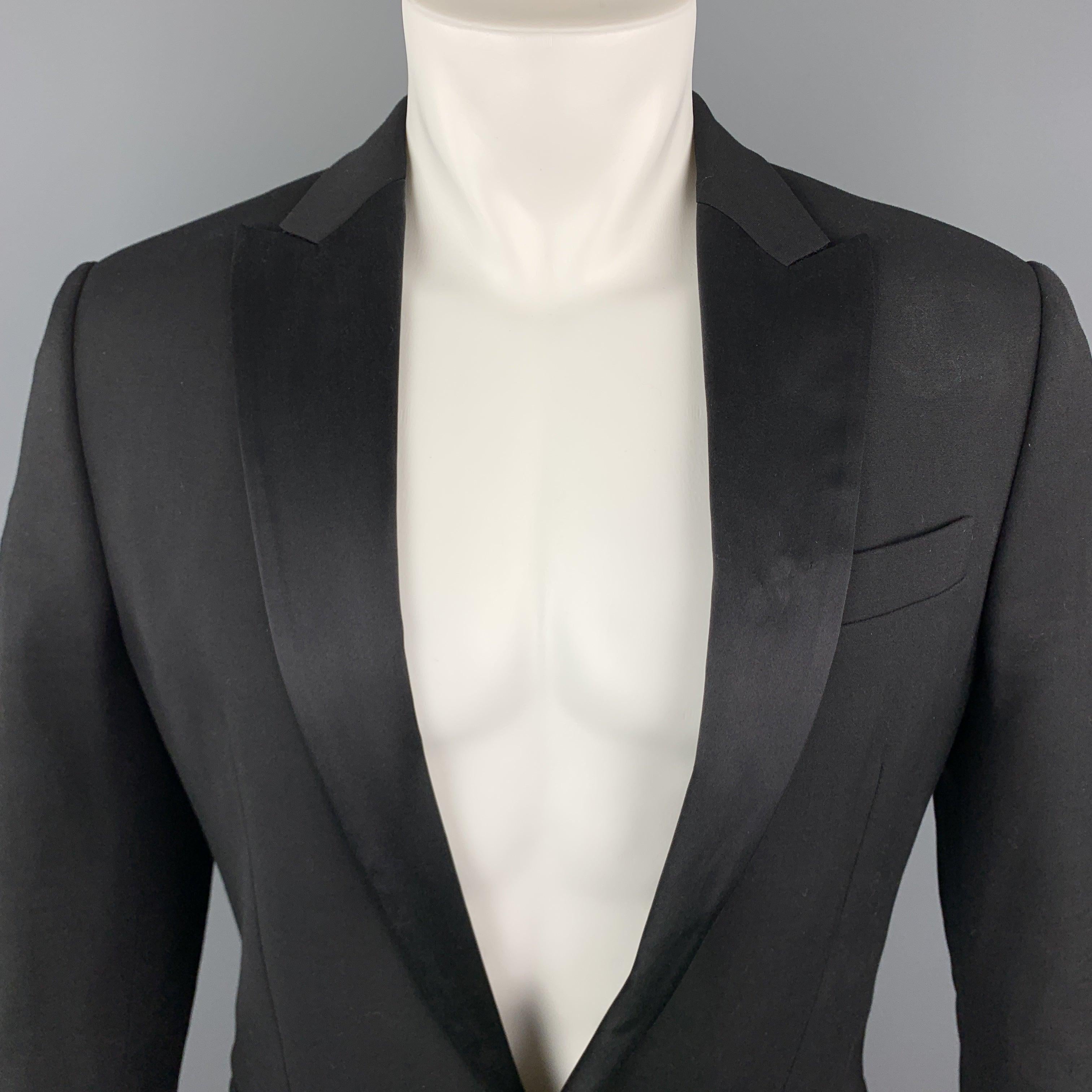 DSQUARED2
tuxedo dinner jacket comes in stretch woven wool with a satin peak lapel, single breasted, one button front, and functional button cuffs. Made in Italy.Excellent Pre-Owned Condition.
 

Marked:   IT 50 

Measurements: 
 
Shoulder: 18