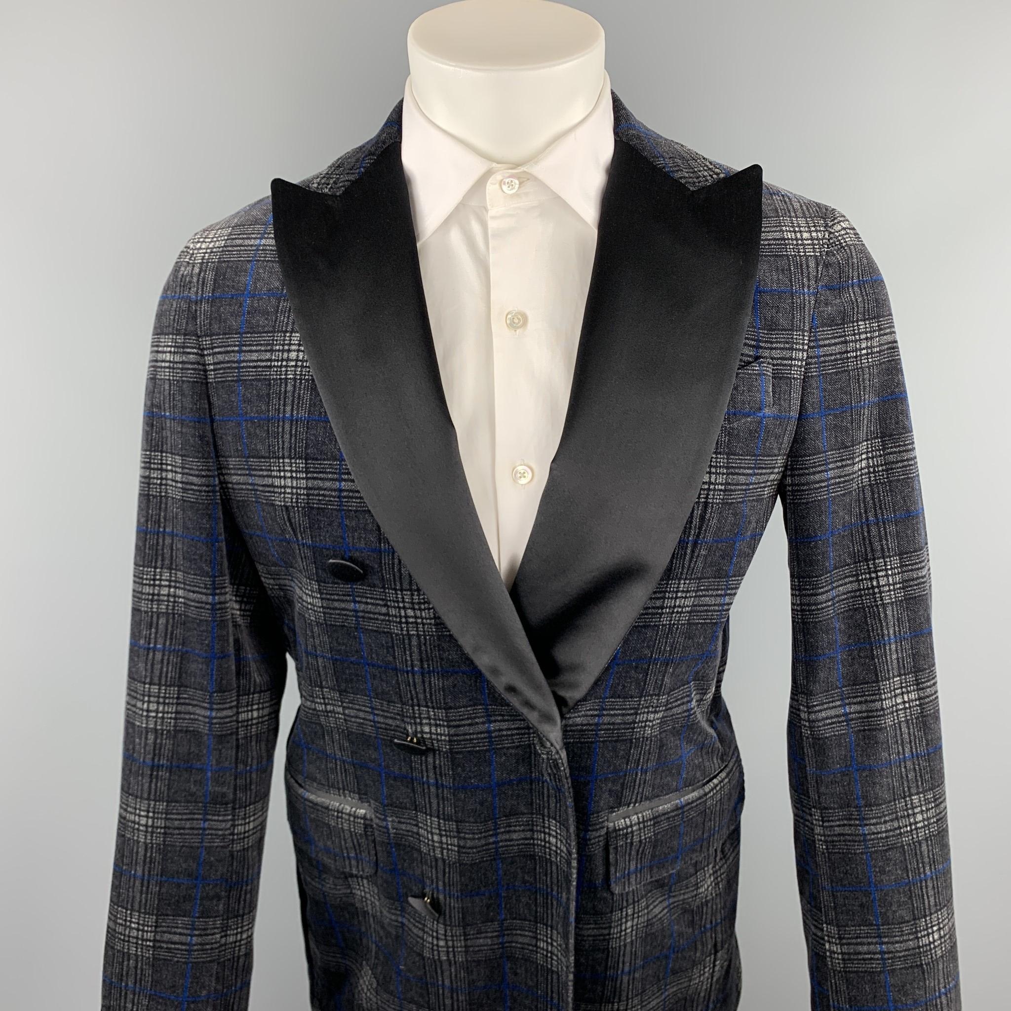 DSQUARED2 sport coat comes in a black & grey plaid velvet featuring a peak lapel, flap pockets, and a double breasted closure. Made in Italy.

Very Good Pre-Owned Condition.
Marked: IT 50

Measurements:

Shoulder: 17.5 in. 
Chest: 38 in. 
Sleeve: 26